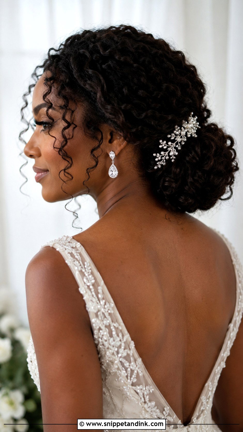 Low Curly Bun for Curly Hair - Snippet and Ink - 20 Low Wedding Updo Ideas