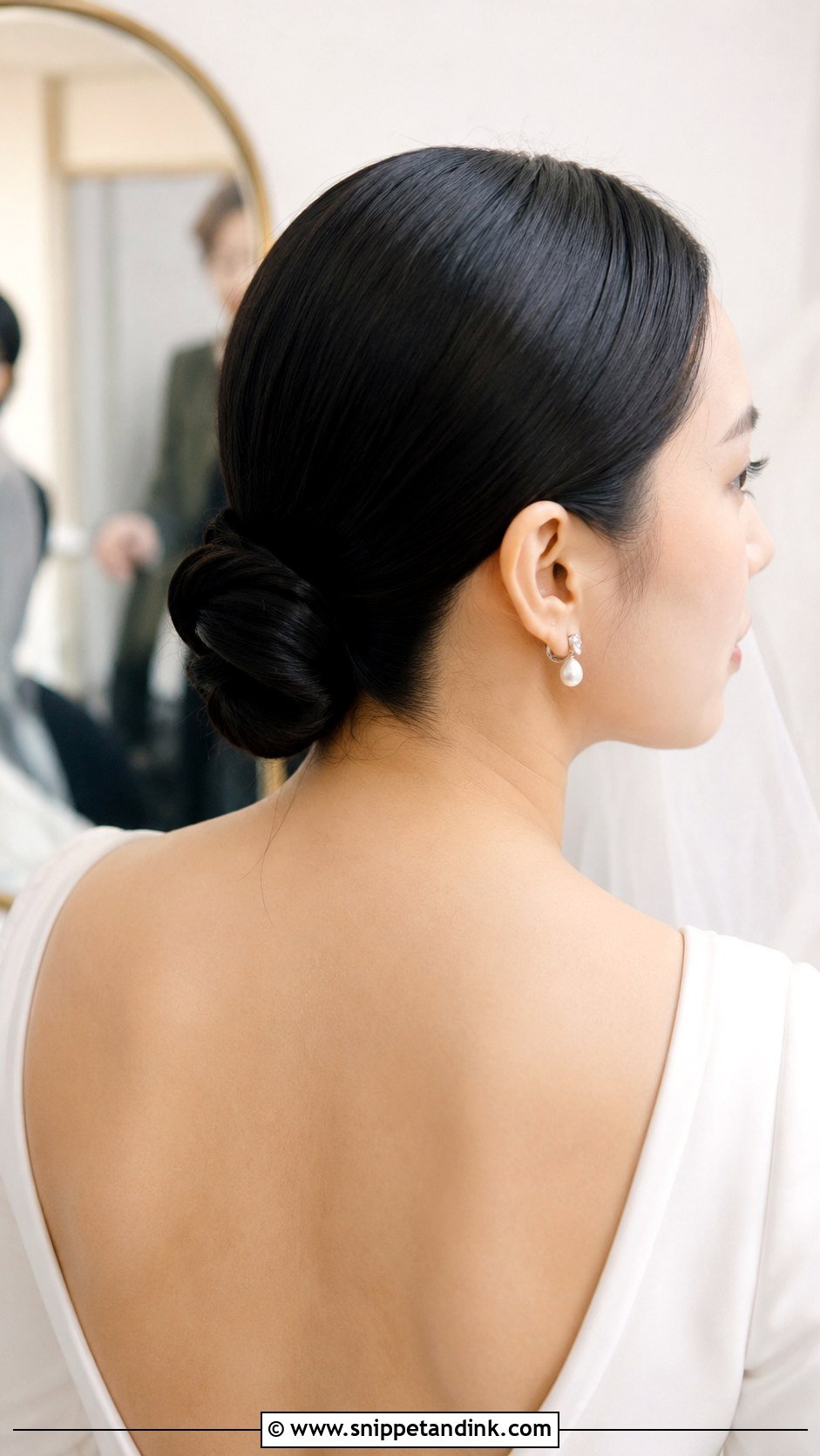 Low Knot With Center Part - Snippet and Ink - 25 Hairstyles for Medium Length Hair for Wedding
