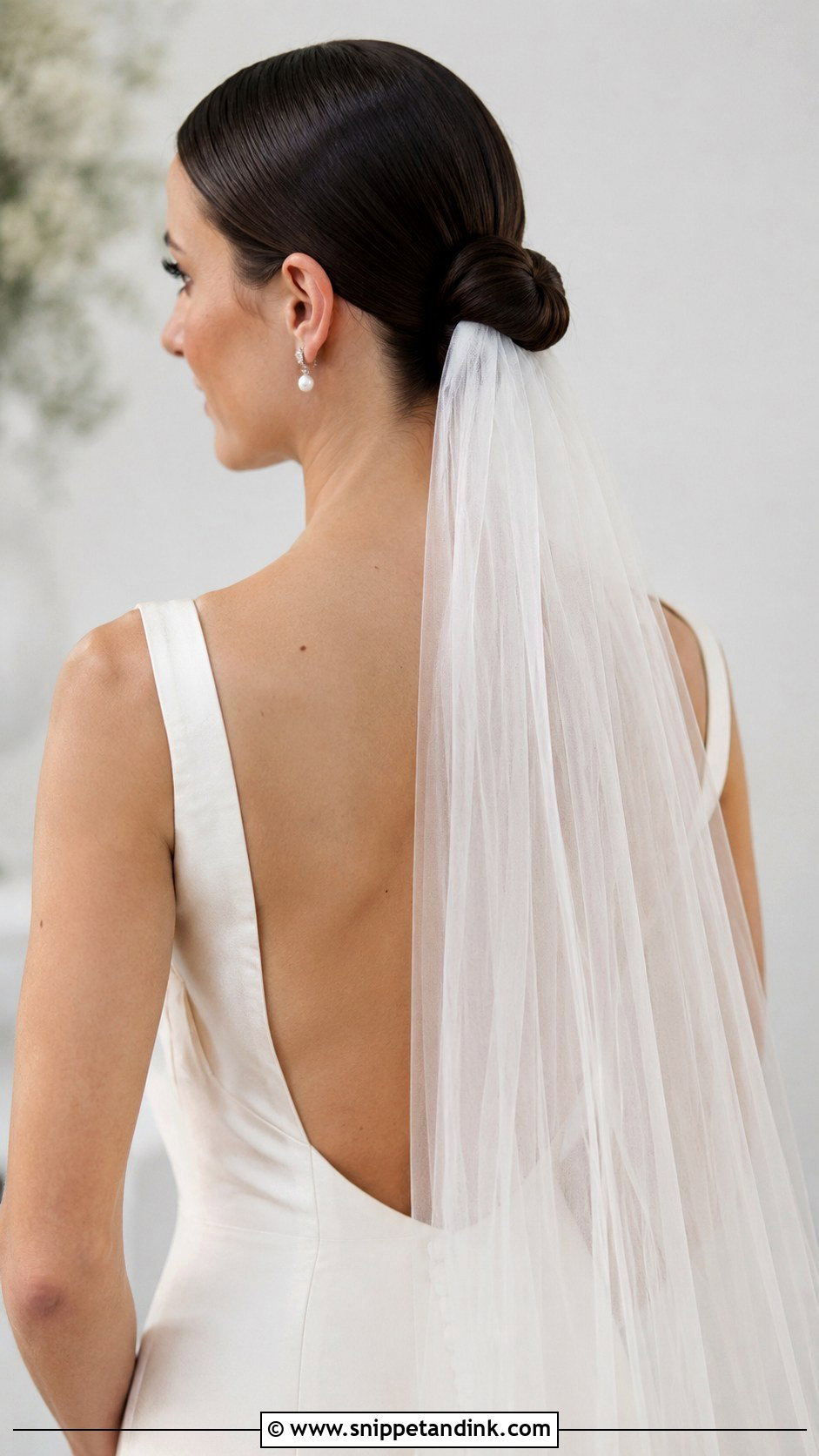 Low Knotted Bun With Veil - Snippet and Ink - 20 Sofia Richie Wedding Hair Ideas