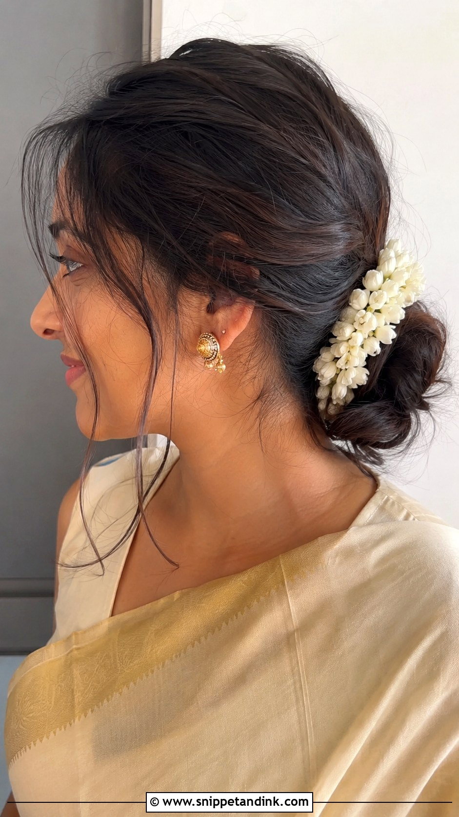 Low Messy Bun With Jasmine Flowers - Snippet and Ink - 20 Indian Hair Styles for Weddings
