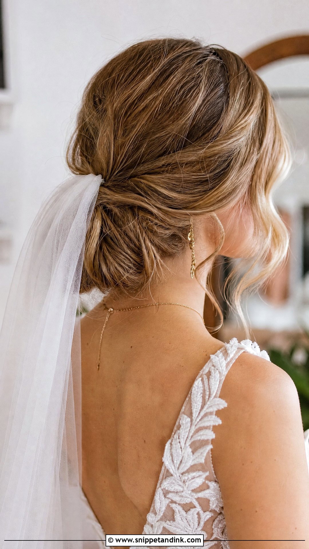 Low Messy Bun With Veil - Snippet and Ink - 20 Bride Bun Hairstyle Ideas