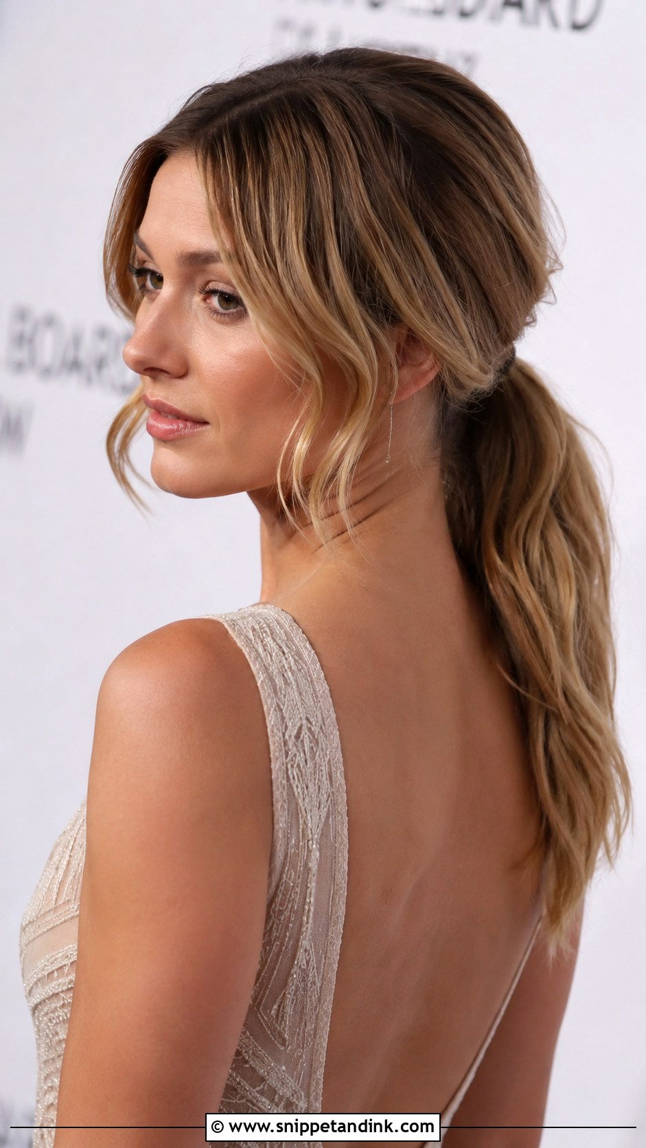 Low Ponytail With Face Framing Waves - Snippet and Ink - 20 Pulled Back Wedding Hair Ideas