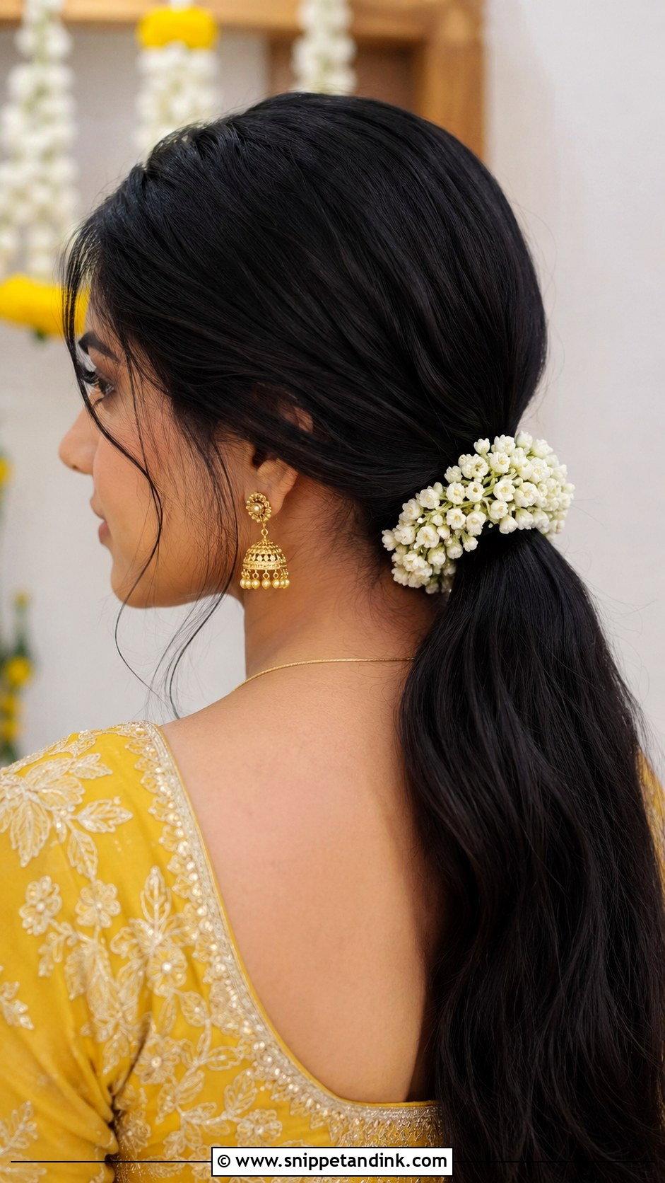 Low Ponytail With Flower Wrap - Snippet and Ink - 25 Haldi Ceremony Hairstyle for Bride Ideas