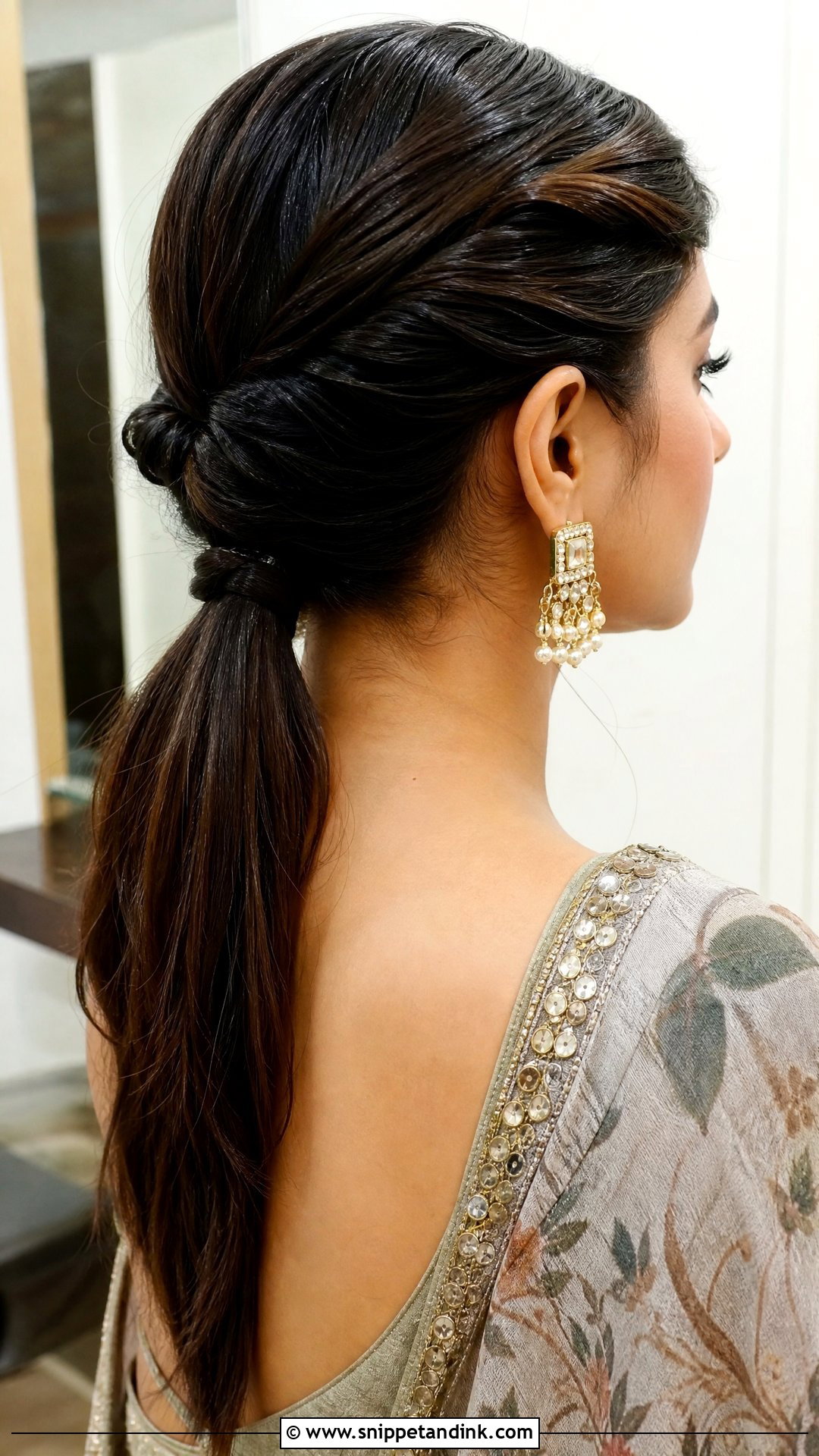 Low Ponytail With Twists - Snippet and Ink - 20 Indian Hairstyle for Wedding Guest Ideas