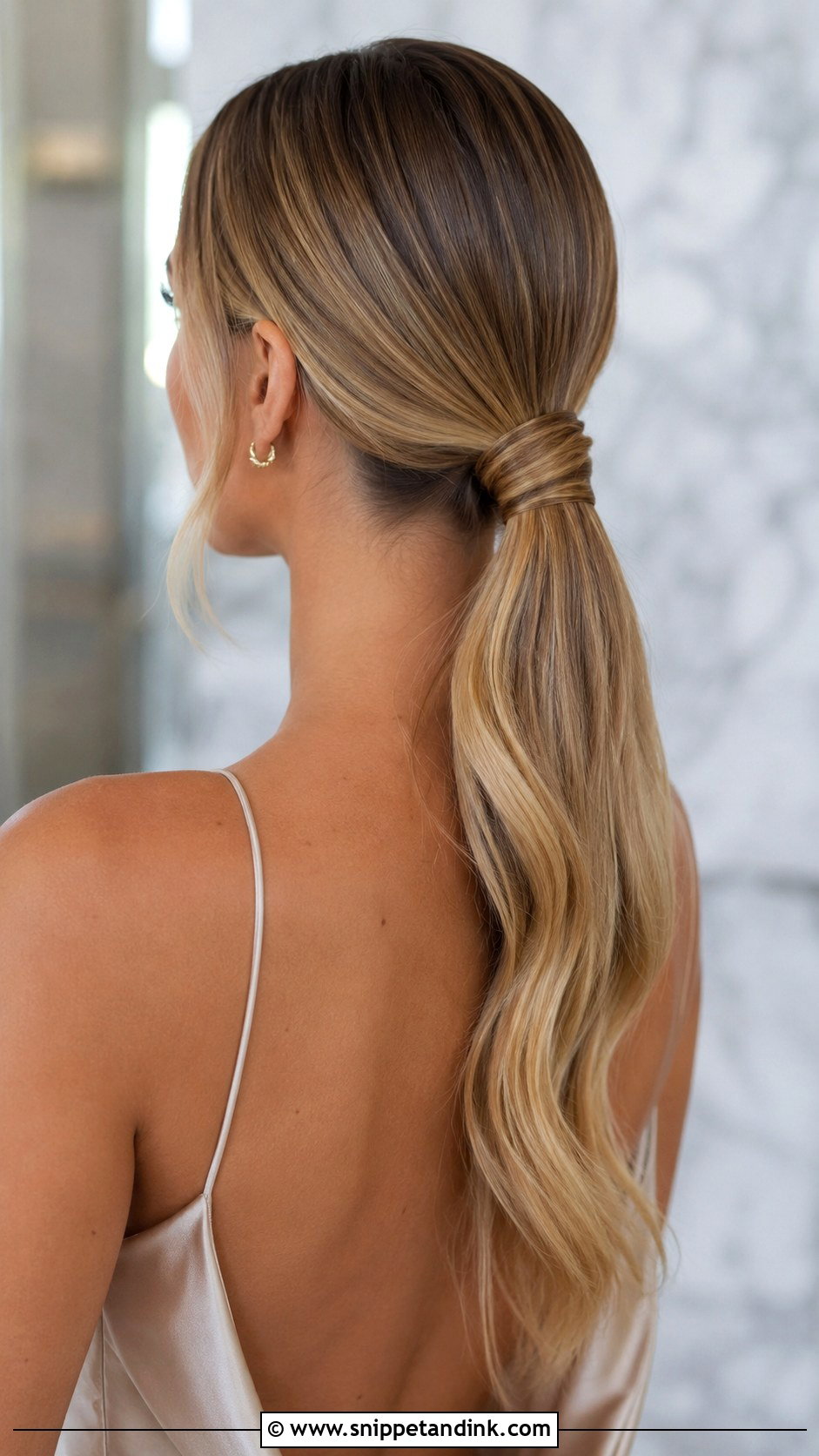 Low Ponytail With Wrapped Detail - Snippet and Ink - 30 Elegant Hairstyles for Wedding Guest