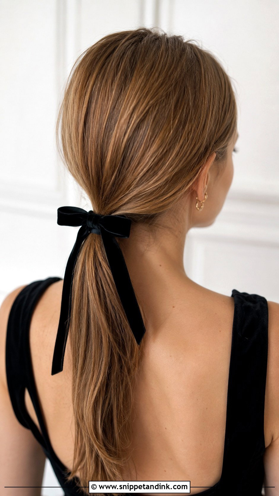 Low Ponytail With a Bow - Snippet and Ink - 30 Hair for Wedding Guest Ideas