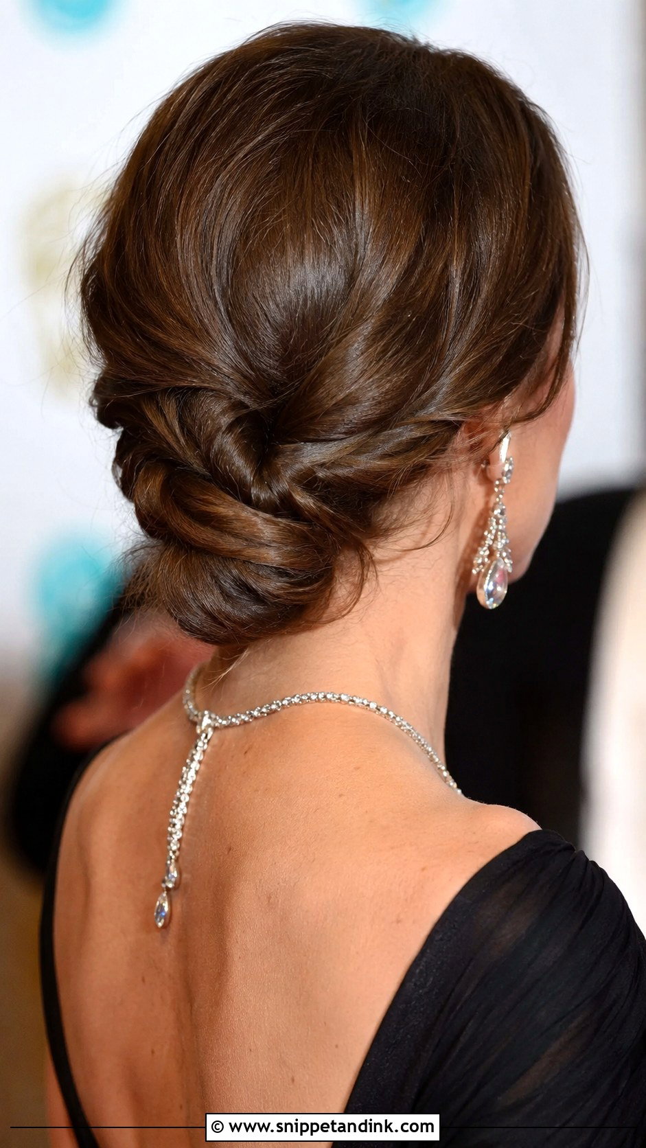 Low Twisted Bun - Snippet and Ink - 30 Wedding Guest Updo Ideas