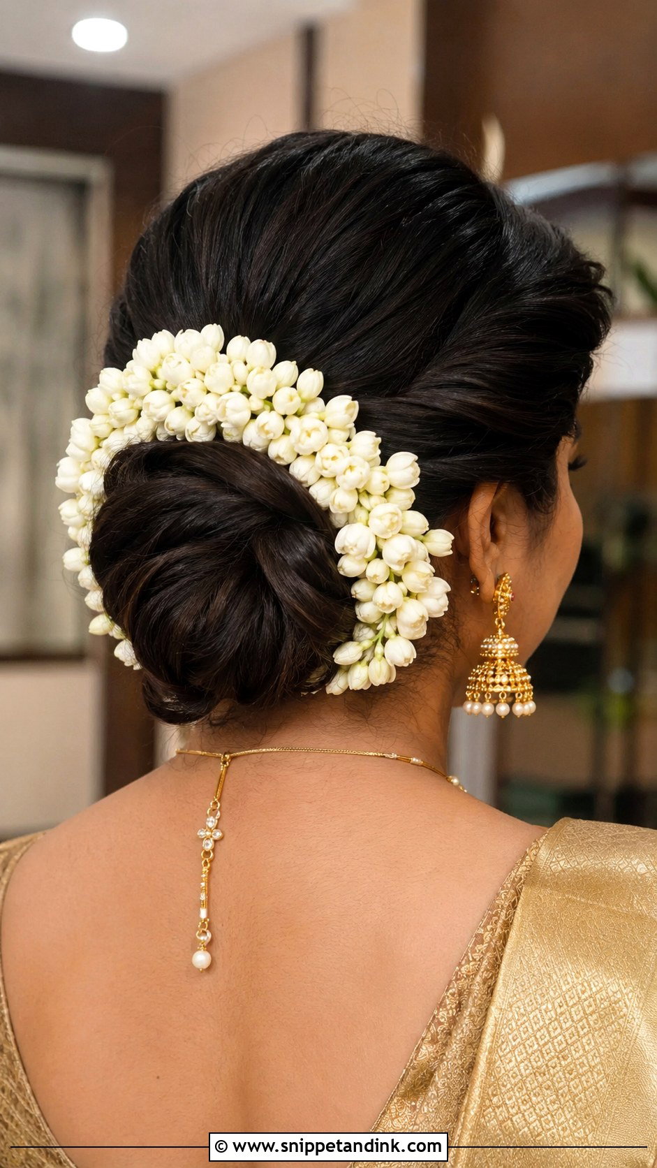 Low Twisted Bun With Jasmine - Snippet and Ink - 20 Indian Bridal Hairstyle Ideas