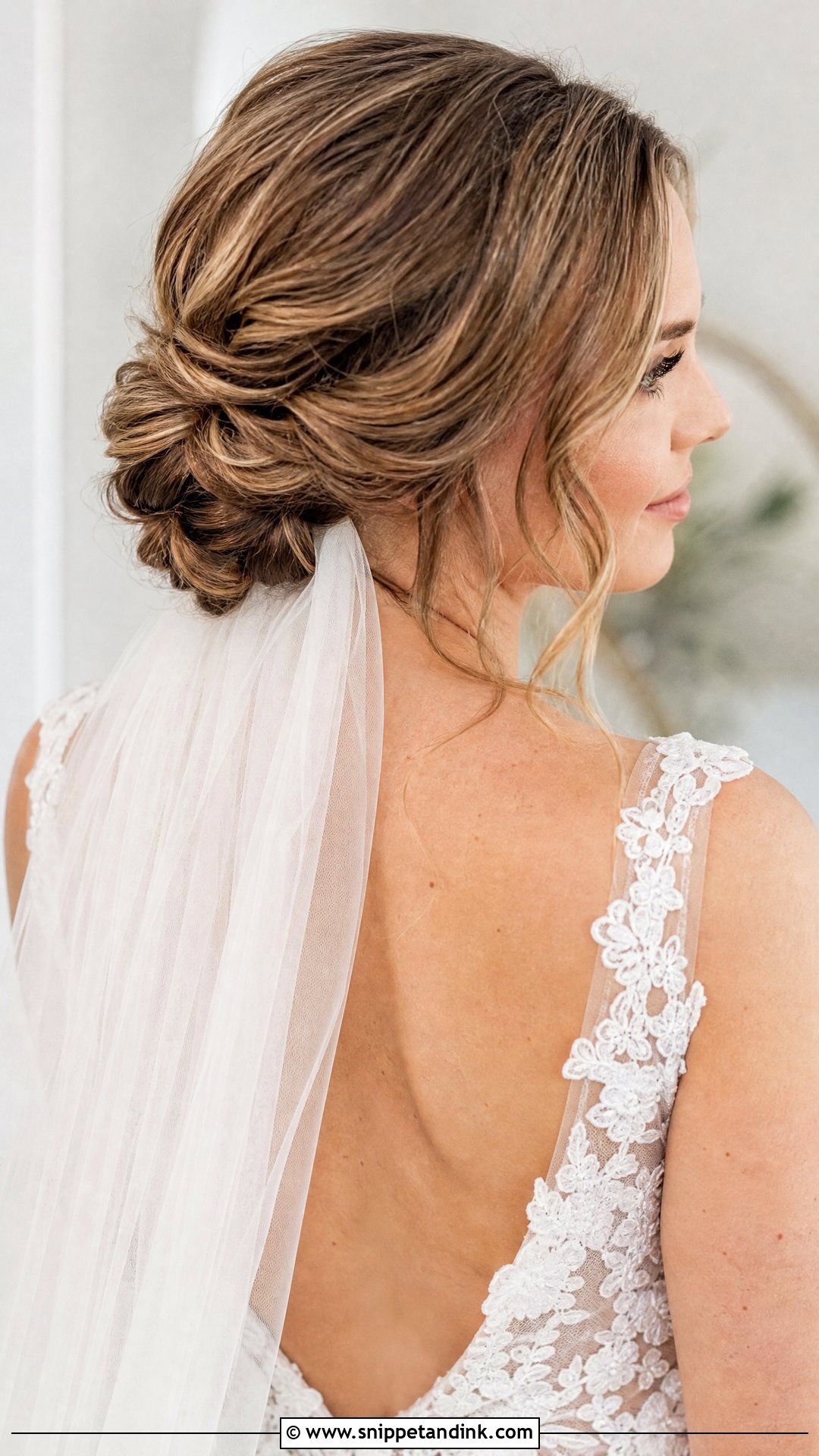 Low Twisted Bun With Veil - Snippet and Ink - 20 Hairstyle for Bridal Ideas