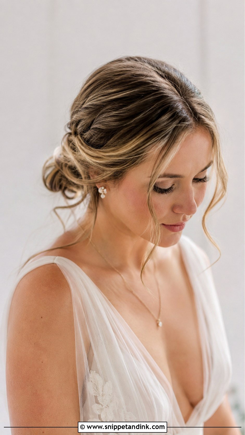 Low Twisted Chignon With Face Framing Strands - Snippet and Ink - 20 Kim K Wedding Hair Ideas