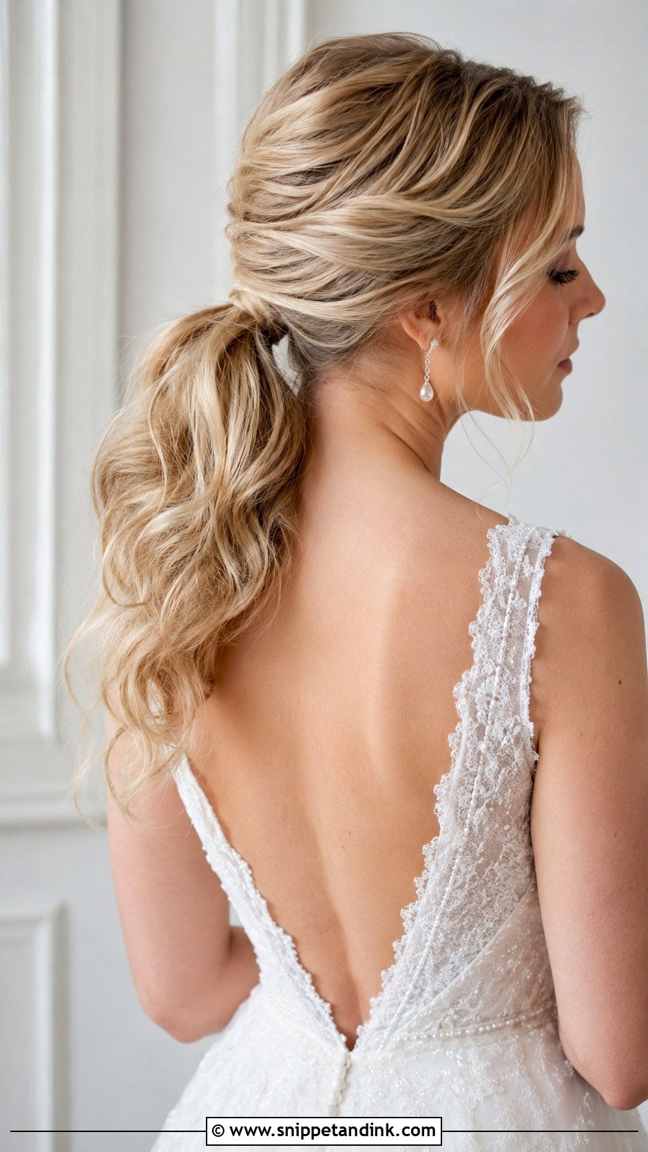 Low Wedding Ponytail With Soft Waves - Snippet and Ink - 25 Wedding Hair Ponytail Ideas