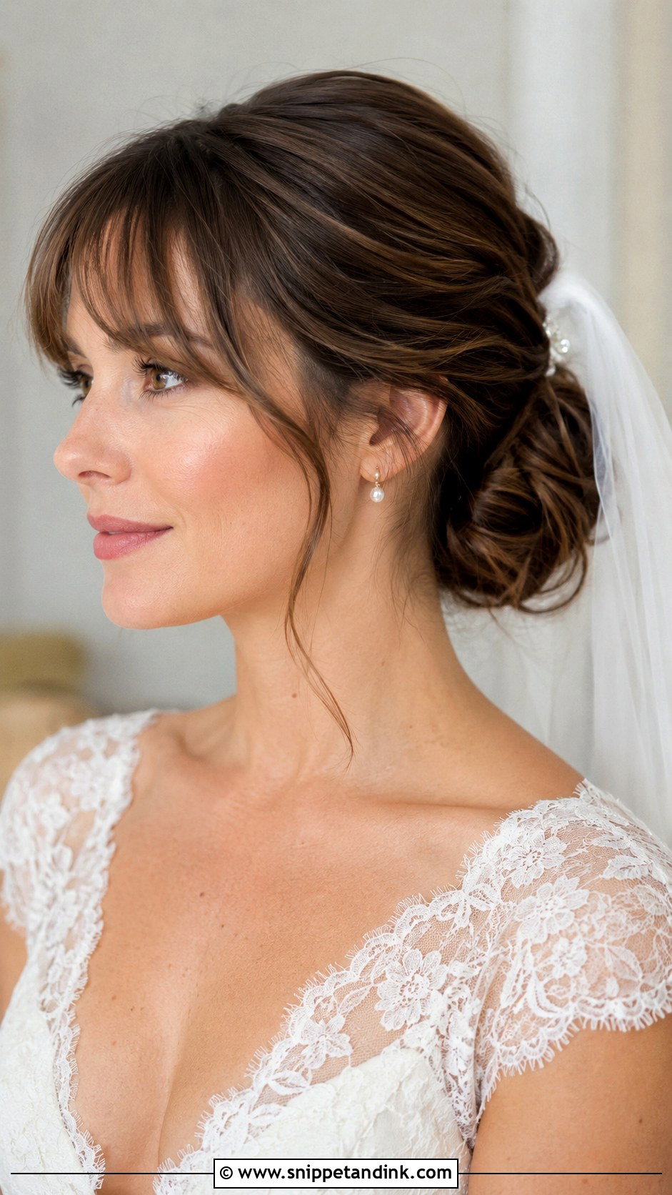 Medium Low Bun Wedding Hairstyle With Wispy Bangs - Snippet and Ink - 15 Medium Wedding Hairstyles with Bangs