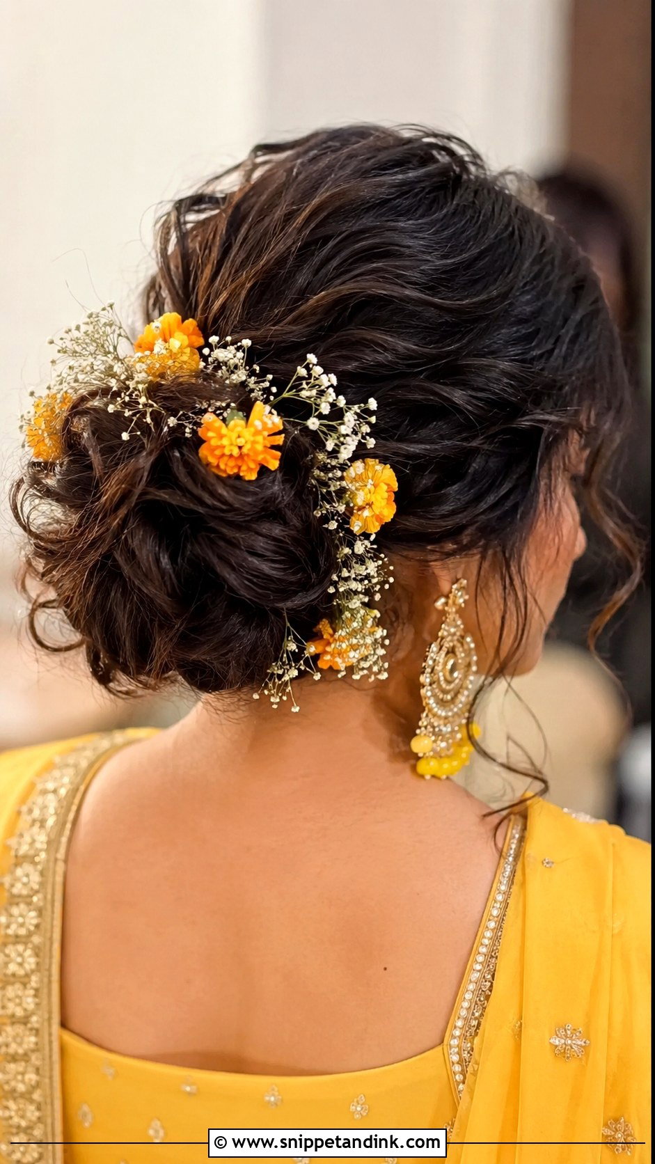 Mendhi Messy Bun With Flowers - Snippet and Ink - 20 Mendhi Bridesmaid Hairstyles