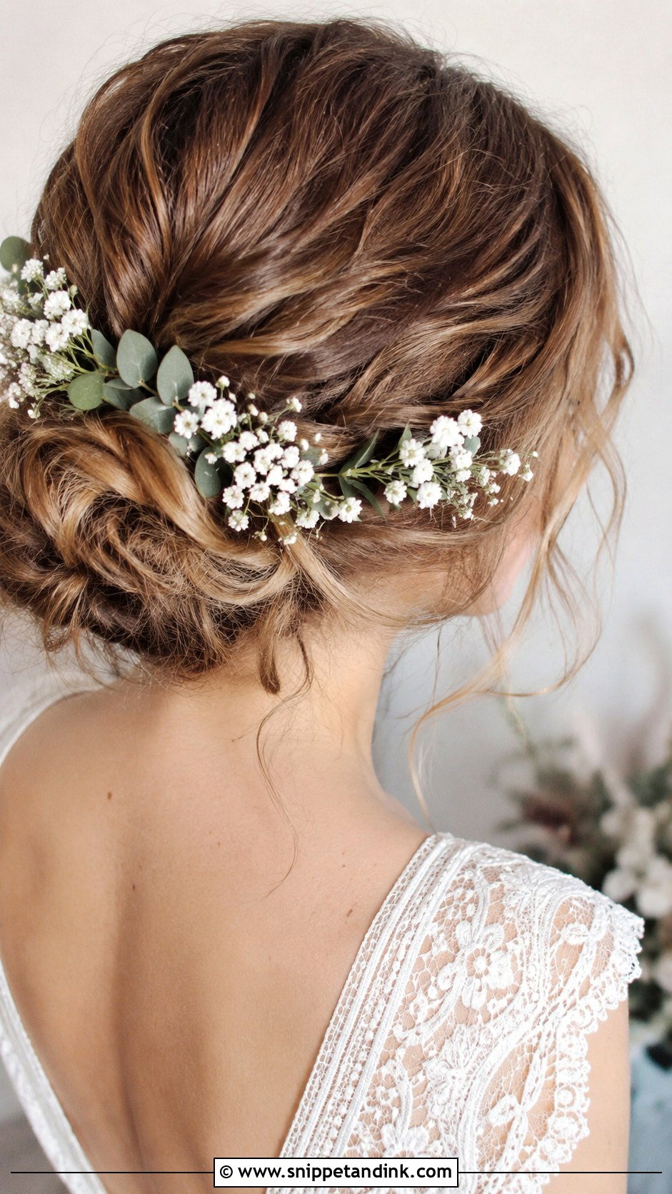 Messy Boho Bun With Flowers - Snippet and Ink - 25 Messy Wedding Hair Ideas