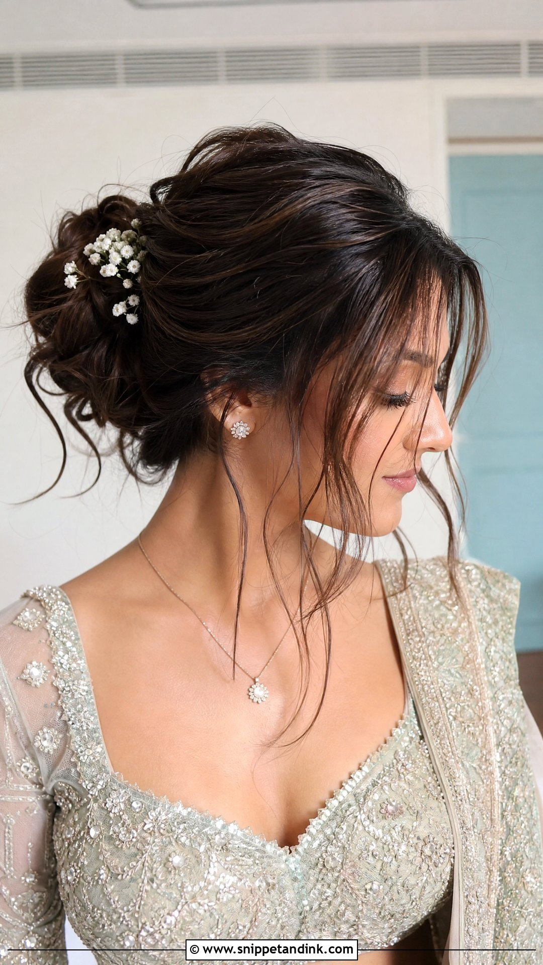 Messy Bun With Loose Strands - Snippet and Ink - 20 Sangeet Bridal Hairstyles