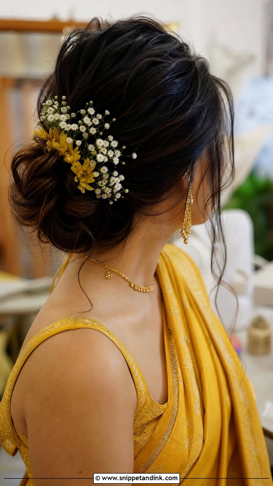 Messy Bun With Loose Strands - Snippet and Ink - 20 South Indian Wedding Hairstyles for Long Hair
