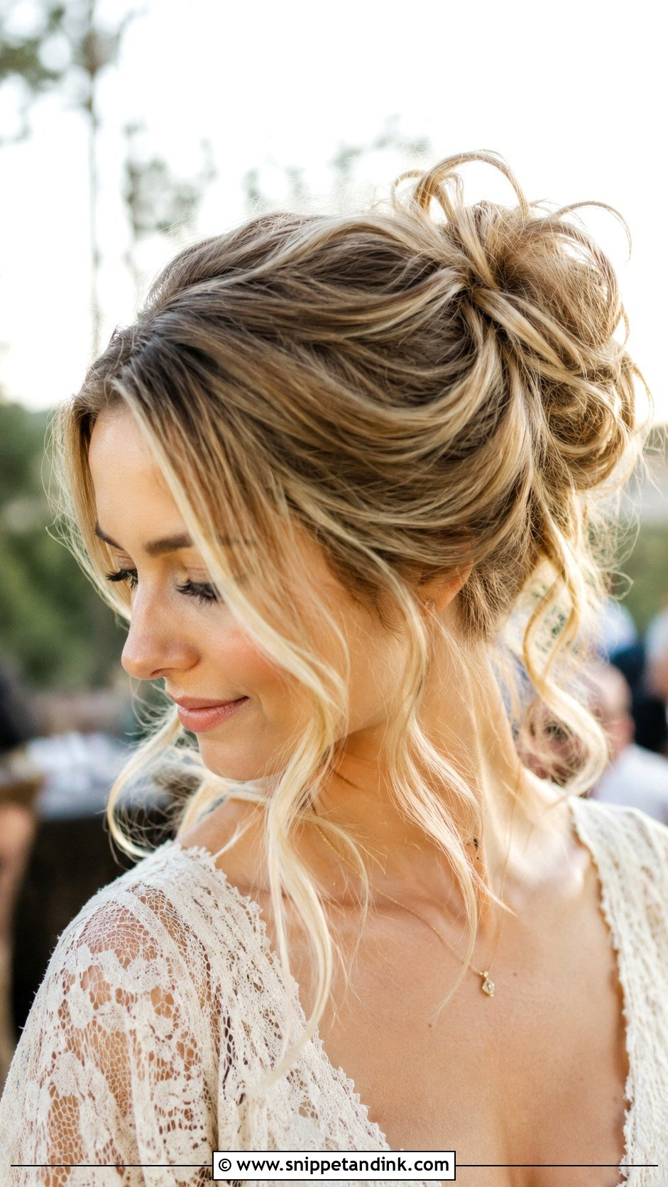 Messy Bun With Loose Tendrils - Snippet and Ink - 20 Hairstyles for Wedding Guest Medium