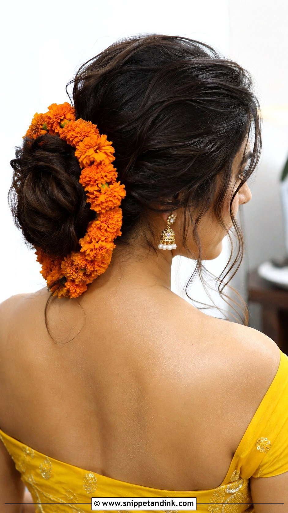 Messy Bun With Marigold Garland - Snippet and Ink - 25 Hairstyles for Haldi Ceremony