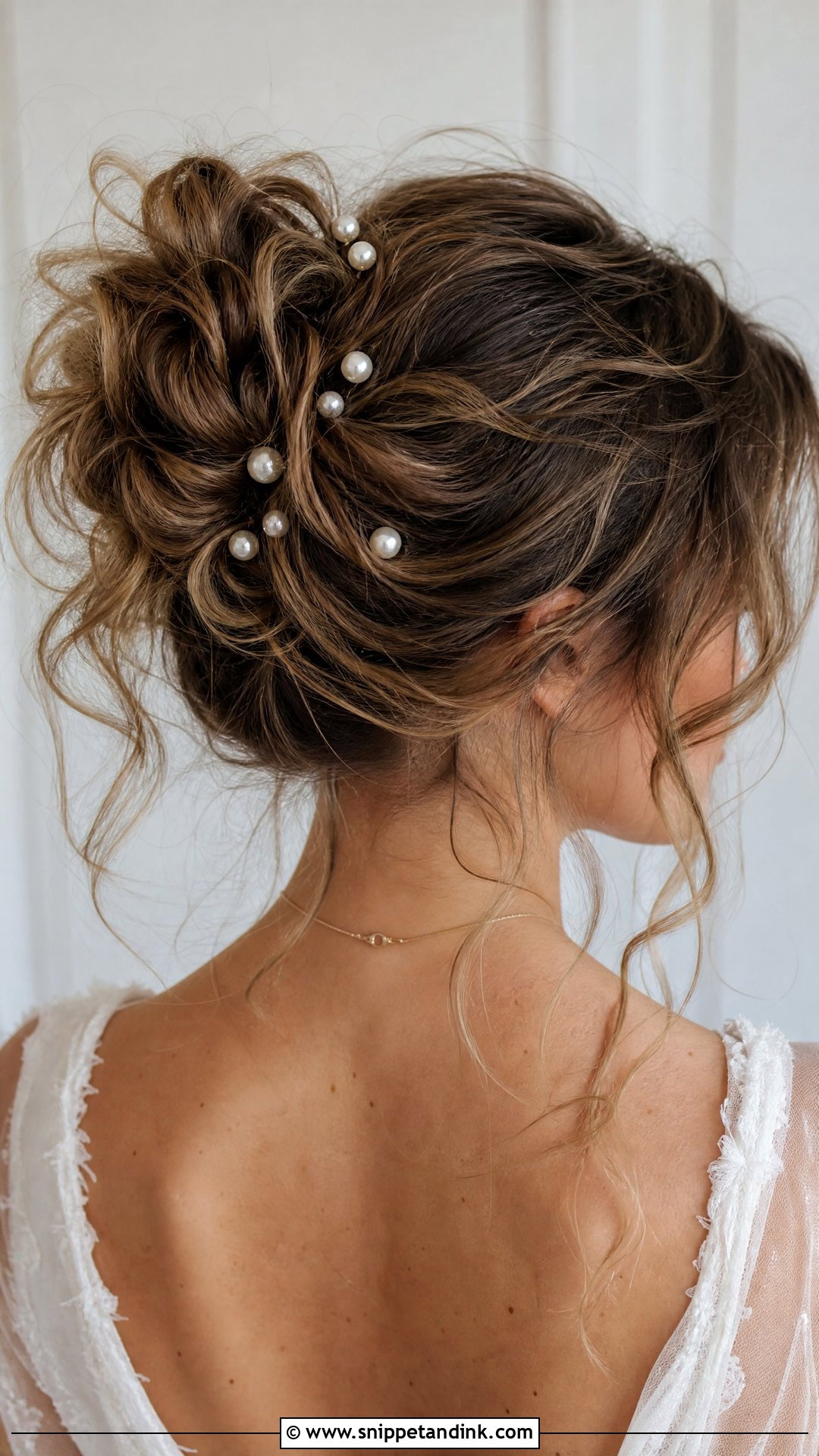 Messy Bun With Pearl Pins - Snippet and Ink - 20 Pearl Wedding Hairstyles