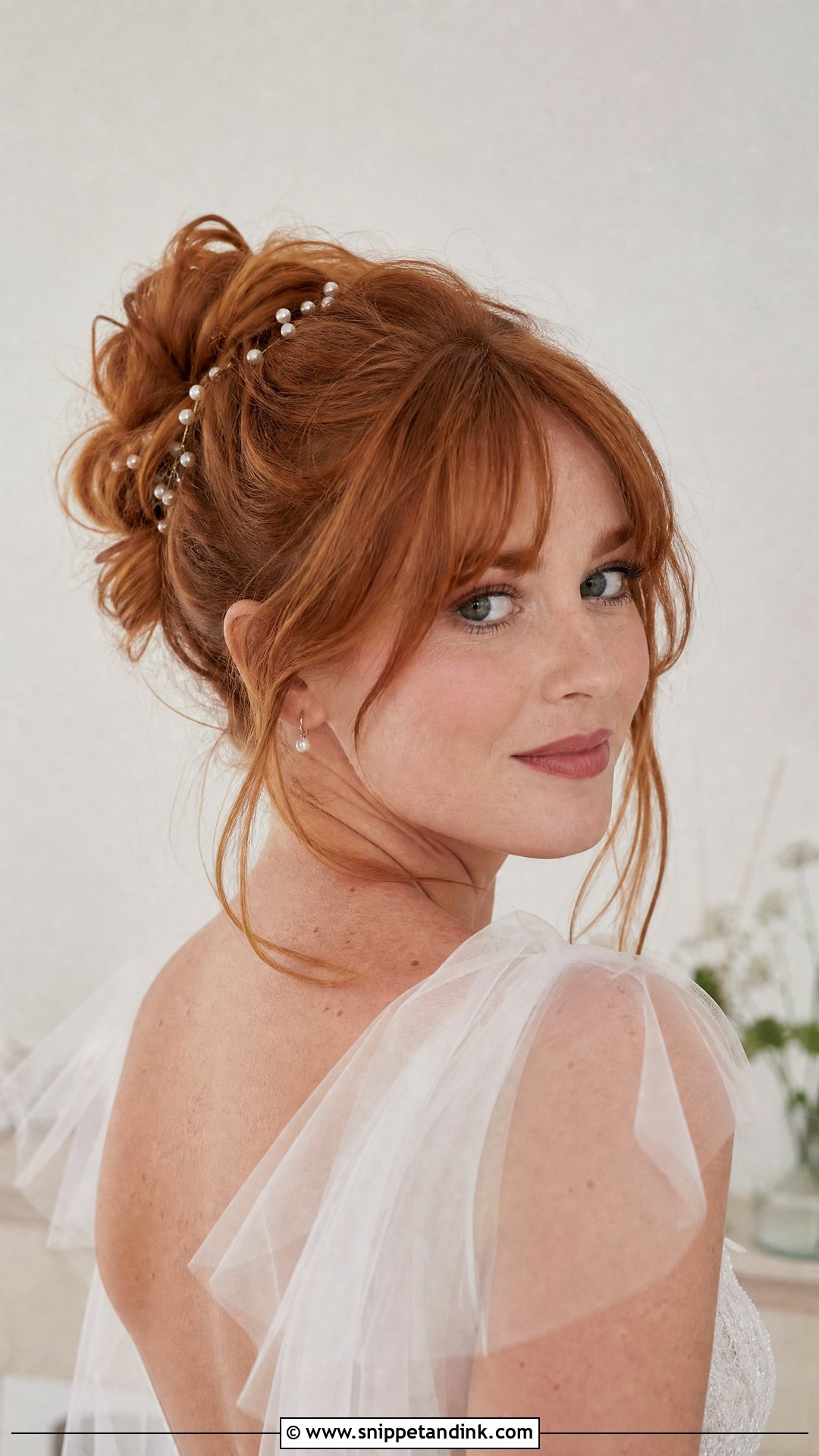 Messy Bun With Soft Bangs - Snippet and Ink - 15 Big Forehead Wedding Hairstyles