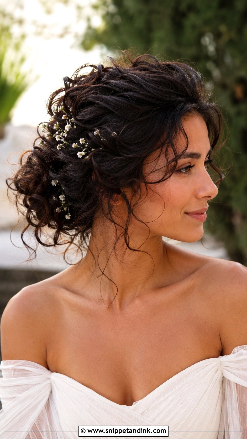 Messy Curly Updo With Flowers - Snippet and Ink - 15 Messy Curly Updo Wedding Ideas