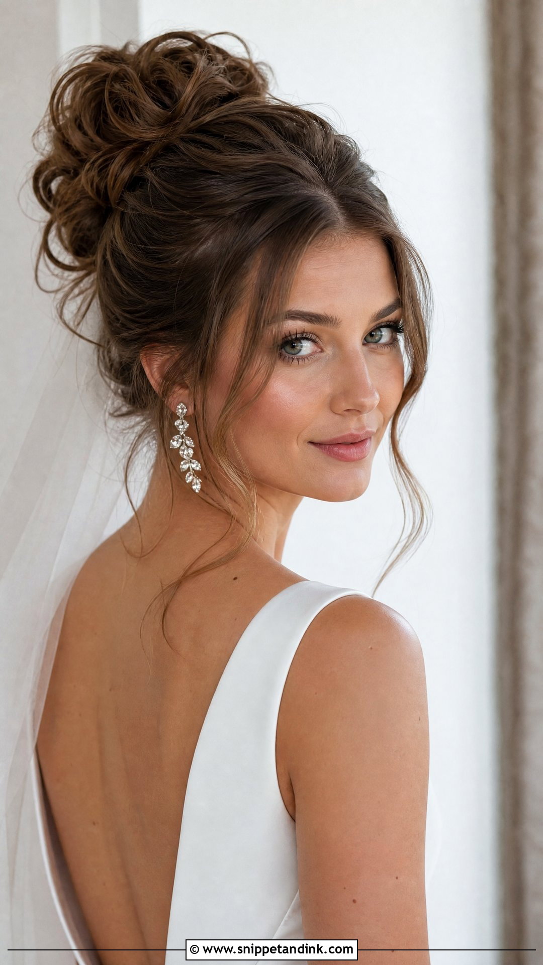 Messy High Bun With Face Framing Tendrils - Snippet and Ink - 20 Modern Bride Hairstyles