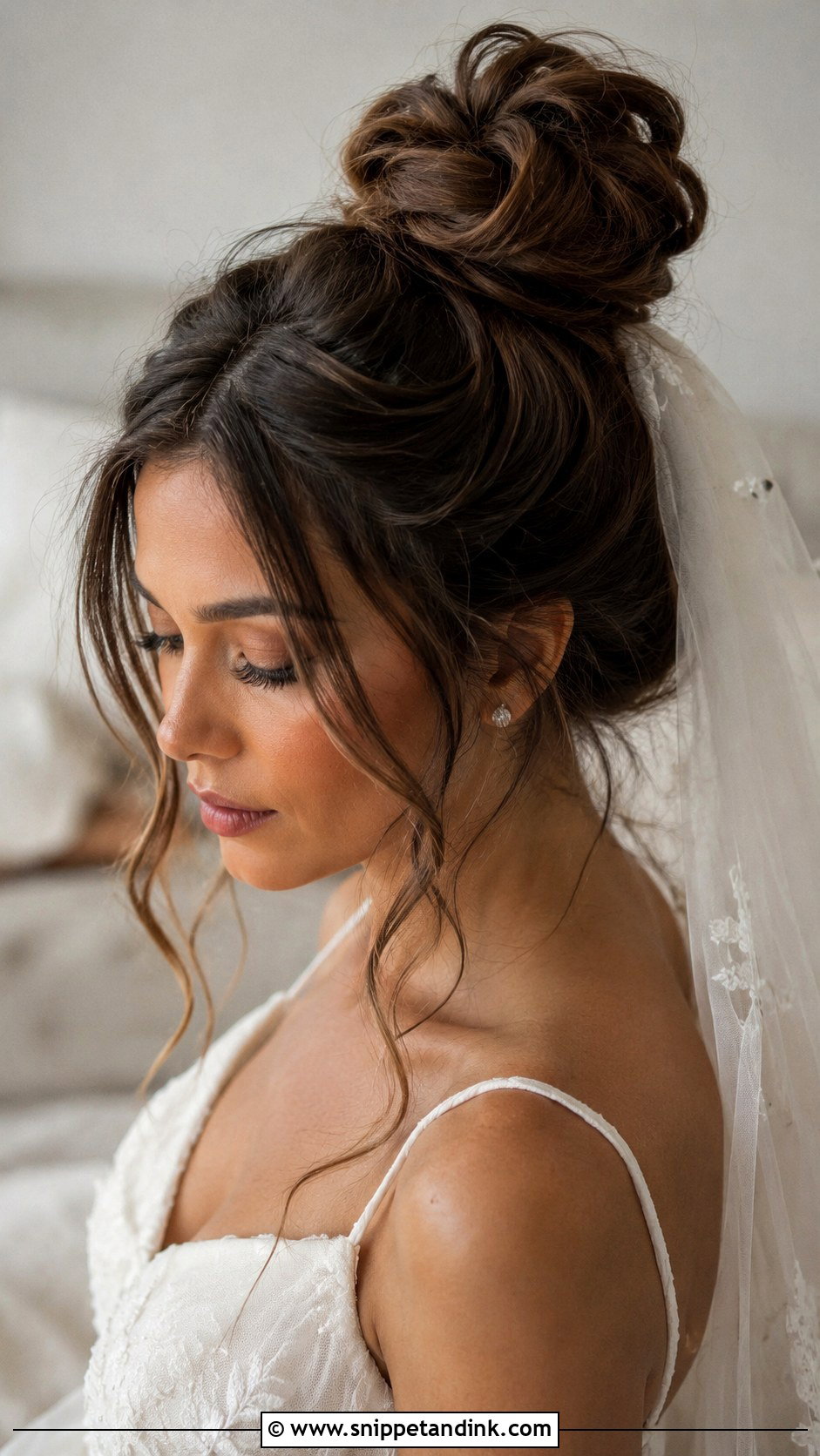 Messy High Bun With Tendrils - Snippet and Ink - 20 Long Hair Wedding Hairstyle Ideas