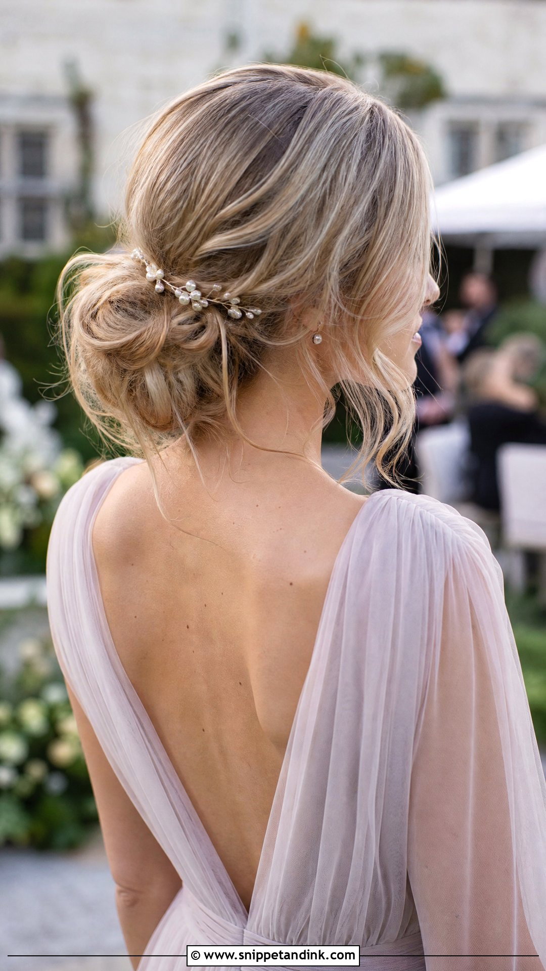 Messy Low Bun - Snippet and Ink - 20 Wedding Guest Long Hairstyles