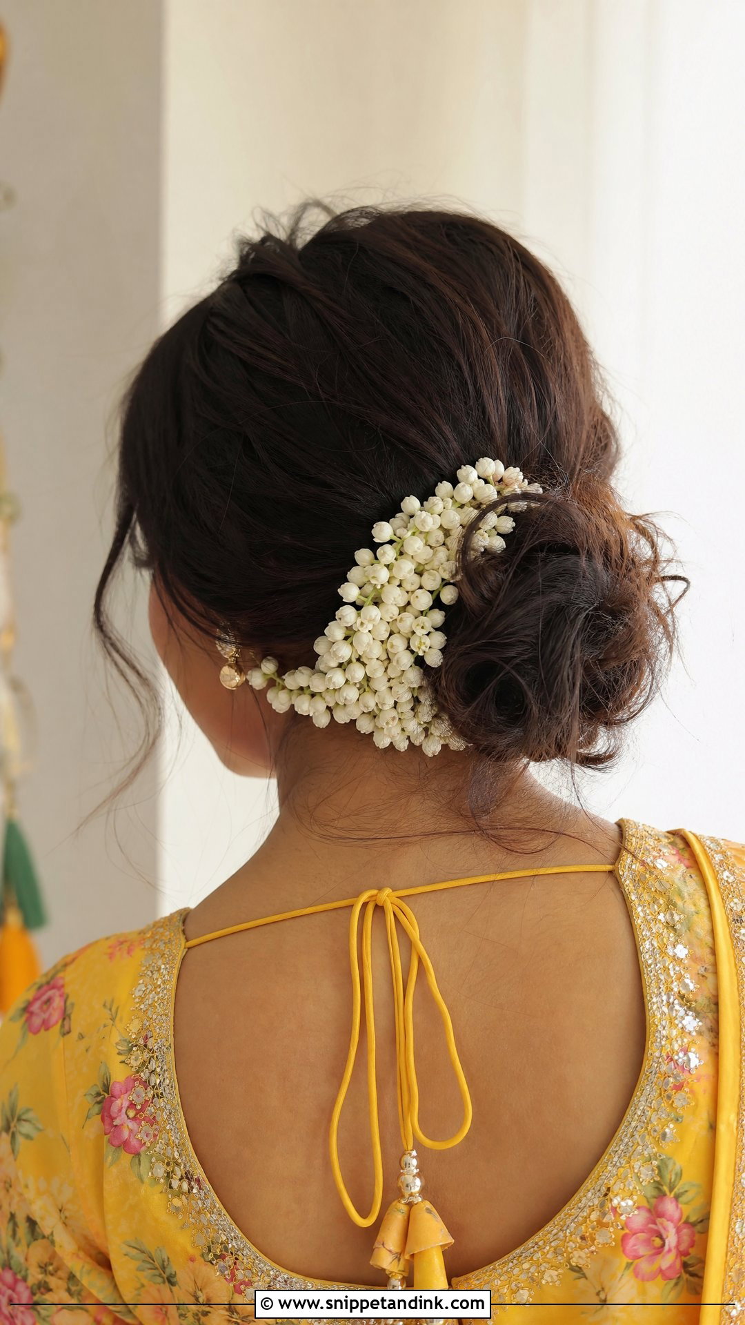 Messy Low Bun With Jasmine Gajra - Snippet and Ink - 20 Hairstyle for Haldi Bride Ideas
