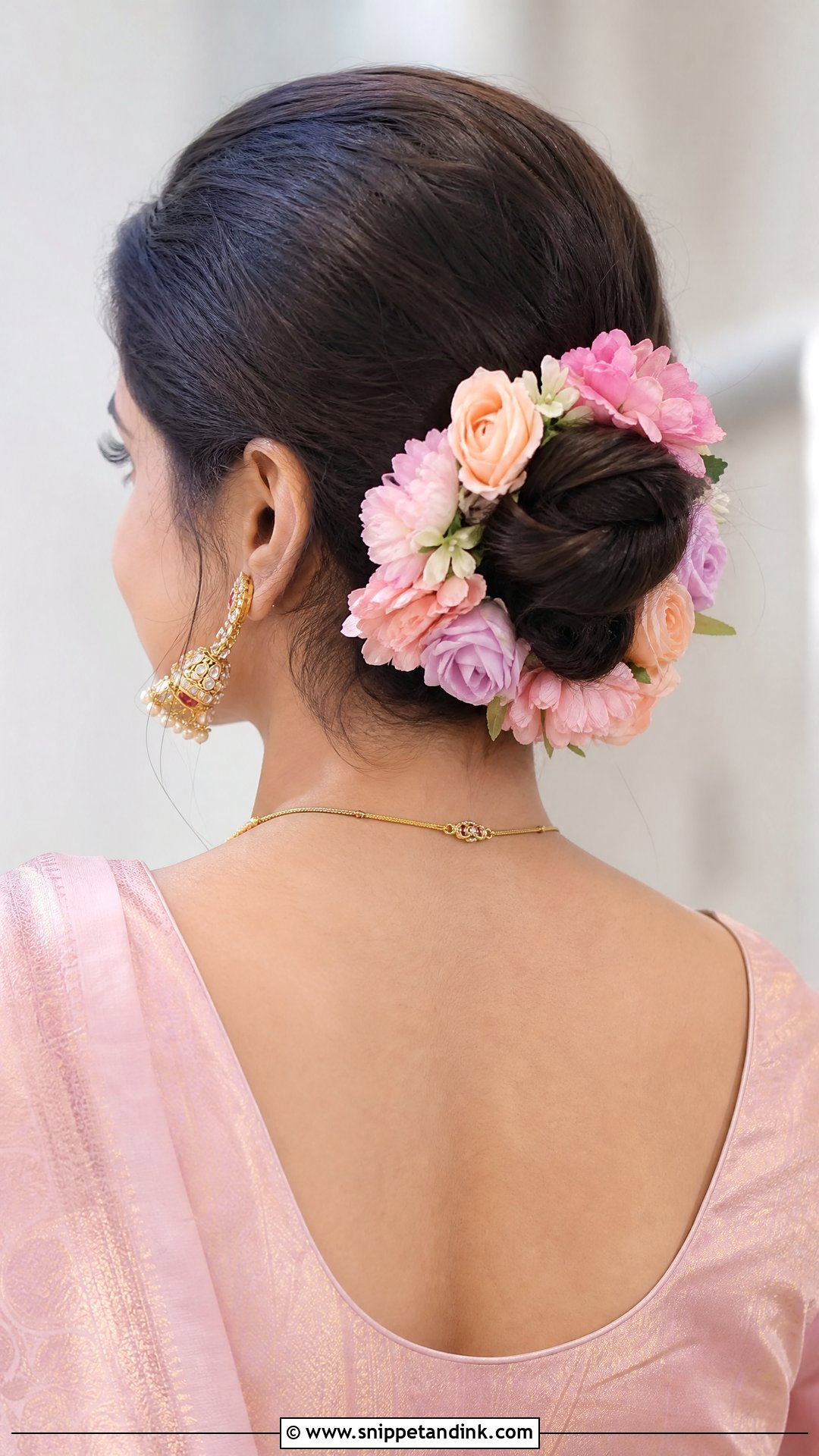 Pastel Faux Flower Bun - Snippet and Ink - 20 Hairstyles for South Indian Wedding