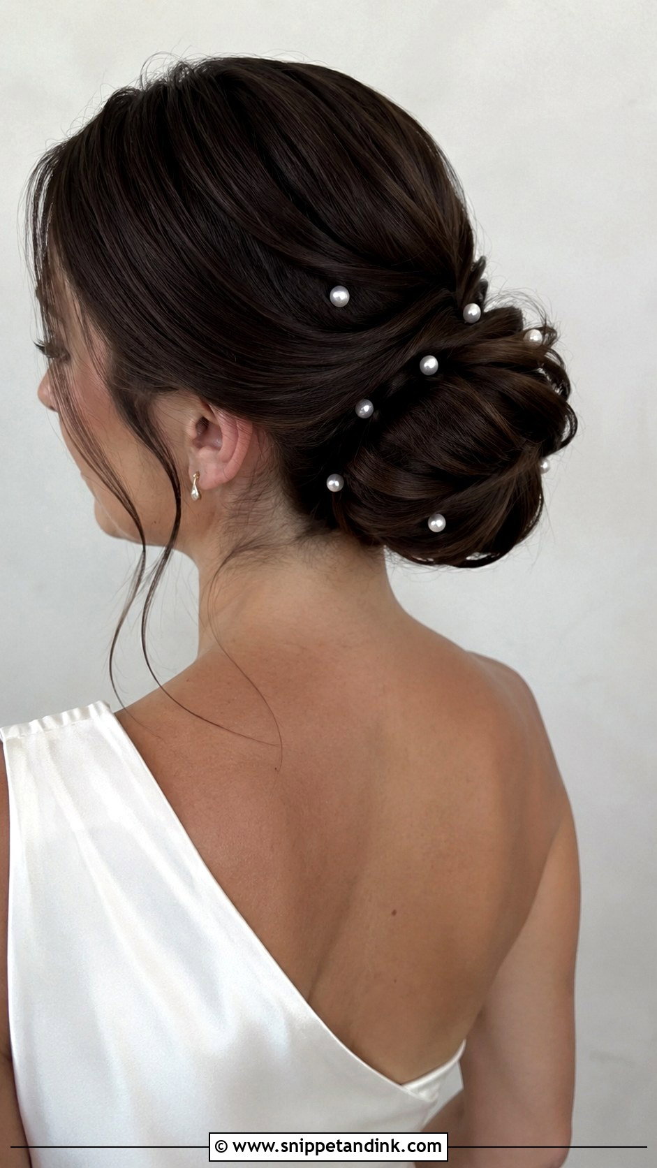 Pearl Accented Bun for Wedding Guest - Snippet and Ink - 20 Bun Hairstyles for Wedding Guest