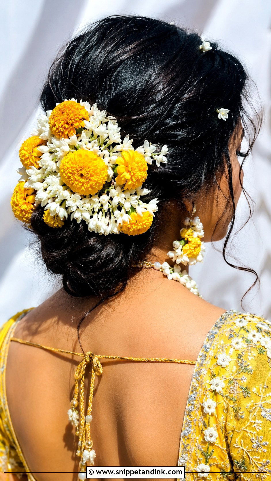 Pithi Low Bun With Flowers - Snippet and Ink - 15 Pithi Hair Styles for Bride