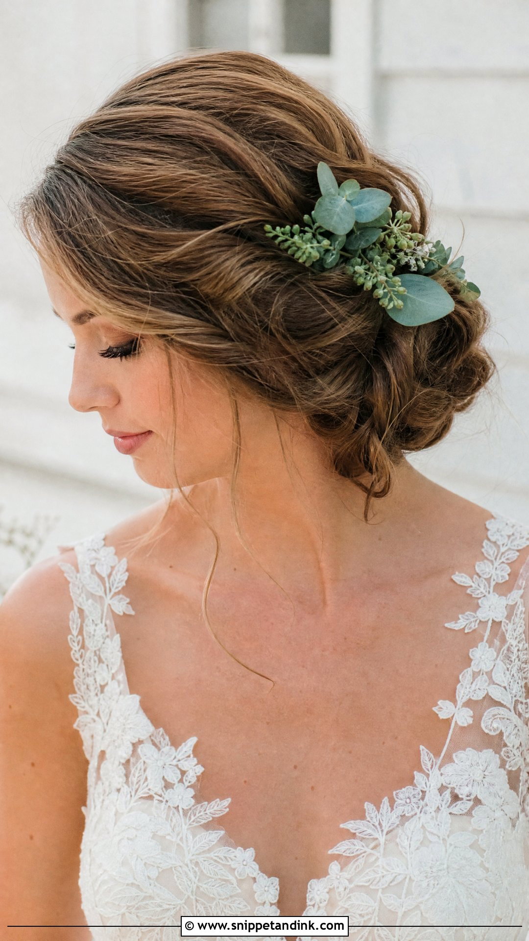 Romantic Side Bun With Greenery - Snippet and Ink - 25 Side Bun Wedding Hair Ideas