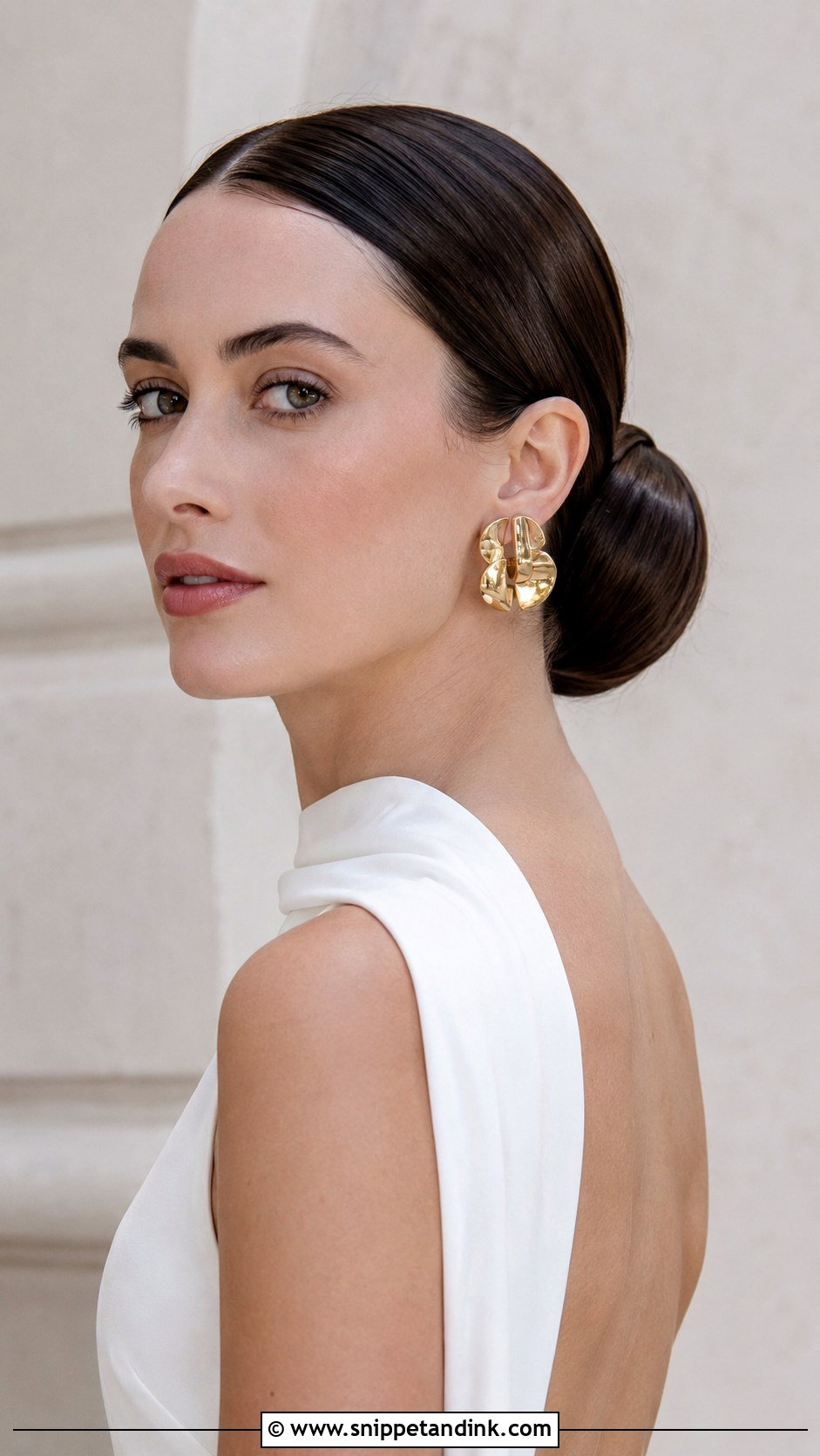 Sculpted Low Bun for Minimalist Brides - Snippet and Ink - 25 Simple Low Bun Wedding Hair Ideas