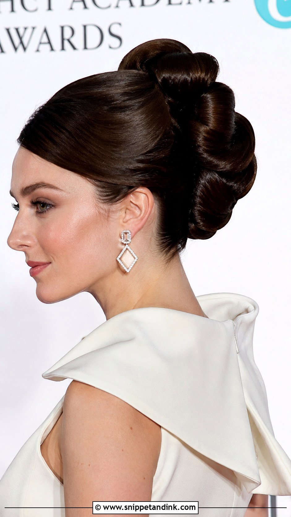 Sculptural Glossy Wave Bun - Snippet and Ink - 25 Glam Bridal Hair Updo Ideas