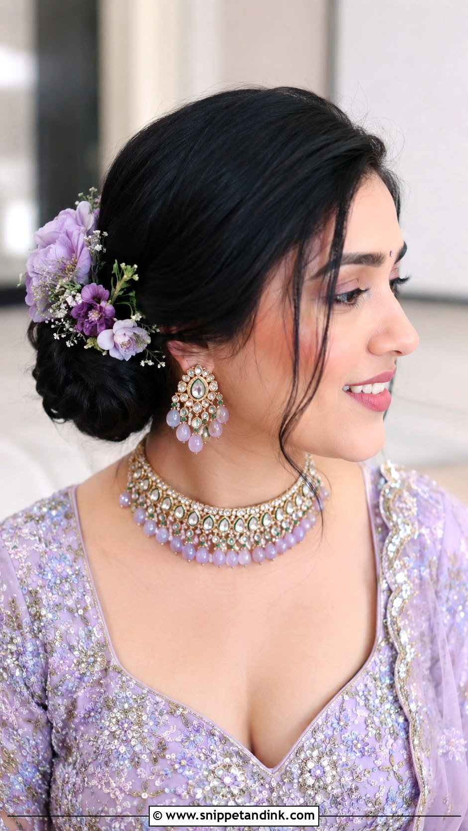 Side Bun With Floral Accent - Snippet and Ink - 20 Indian Wedding Hairstyles for Round Face