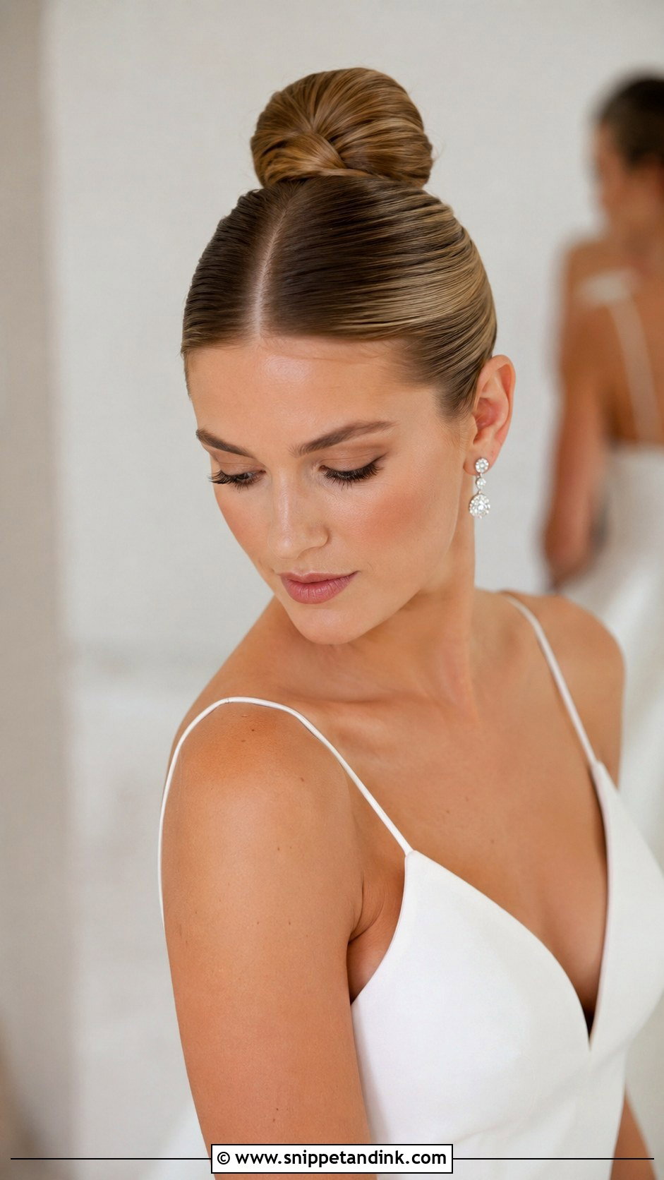 Sleek Ballerina Bun - Snippet and Ink - 30 Hairstyles for Long Hair Wedding