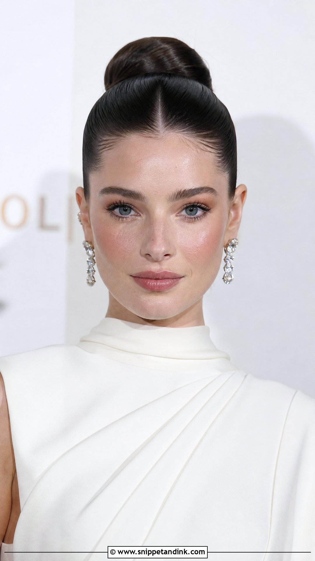 Sleek Ballerina Bun With Center Part - Snippet and Ink - 20 Unique Bridal Hairstyles