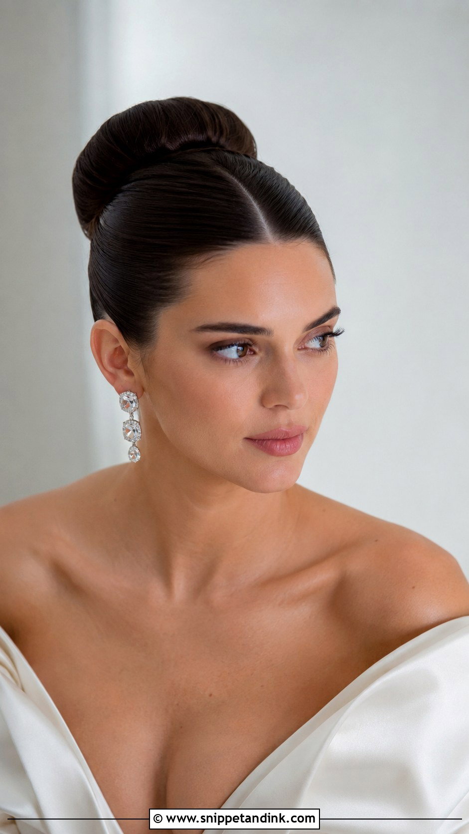 Sleek Ballerina Bun With Center Part - Snippet and Ink - 20 Up Do Hairstyles for Weddings