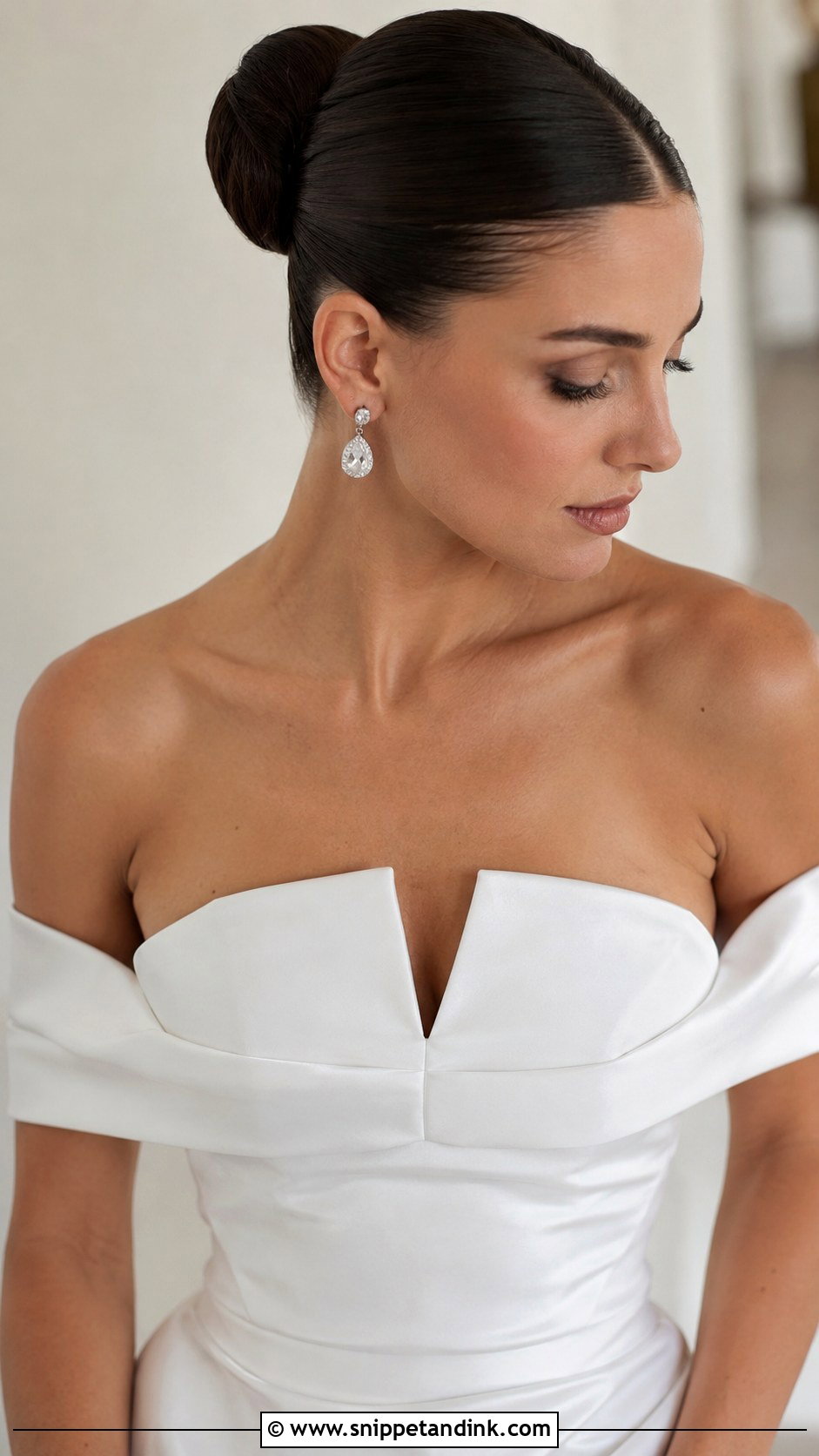 Sleek Bridal Bun With Center Part - Snippet and Ink - 25 Hairstyles for Long Hair for Wedding