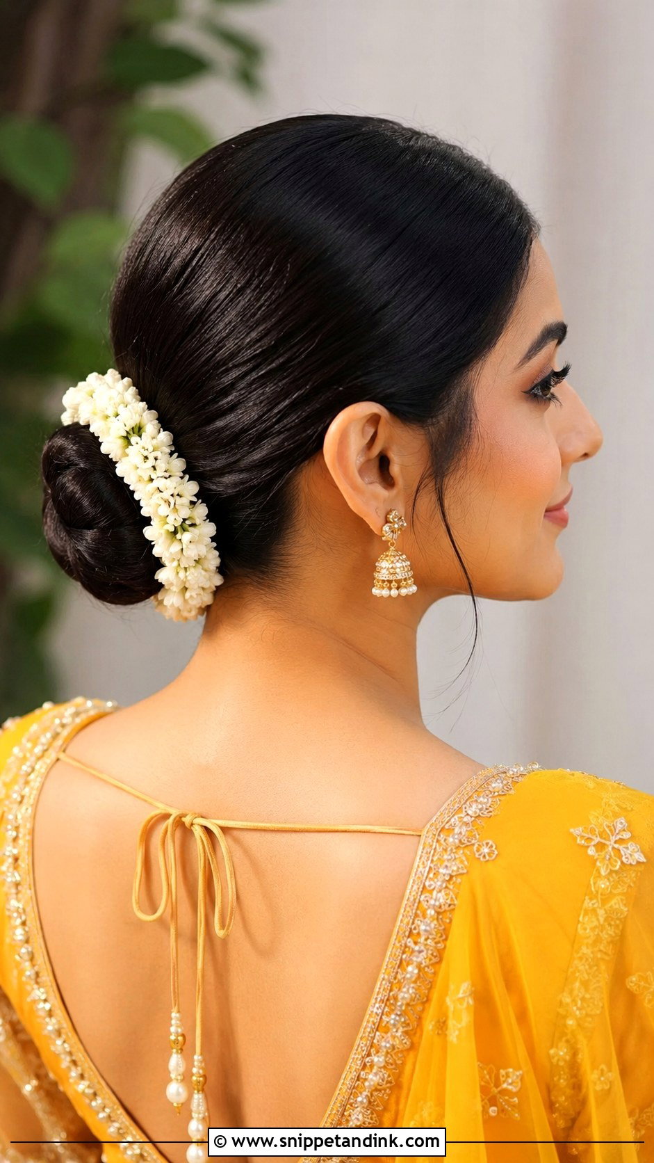 Sleek Bun Hairstyle For Mehndi - Snippet and Ink - 20 Mehndi Event Hairstyles
