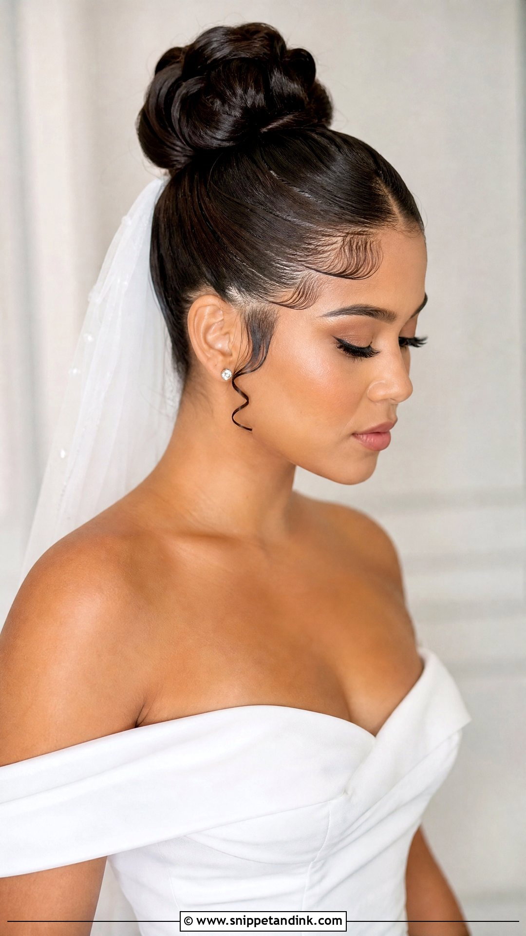Sleek Bun With Baby Hairs - Snippet and Ink - 20 Slick Bun Wedding Ideas
