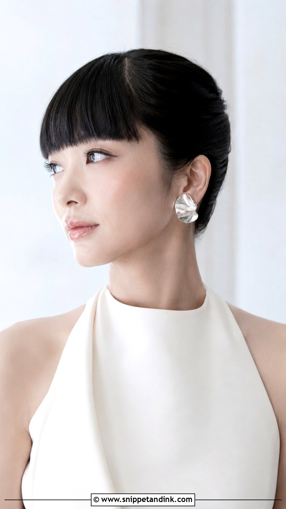 Sleek Bun With Blunt Bangs - Snippet and Ink - 20 Hairstyles with Bangs for Wedding