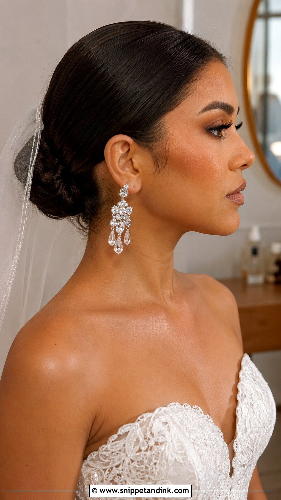 Sleek Bun With Bold Earrings - Snippet and Ink - 25 Sleek Bun Wedding Hair Ideas