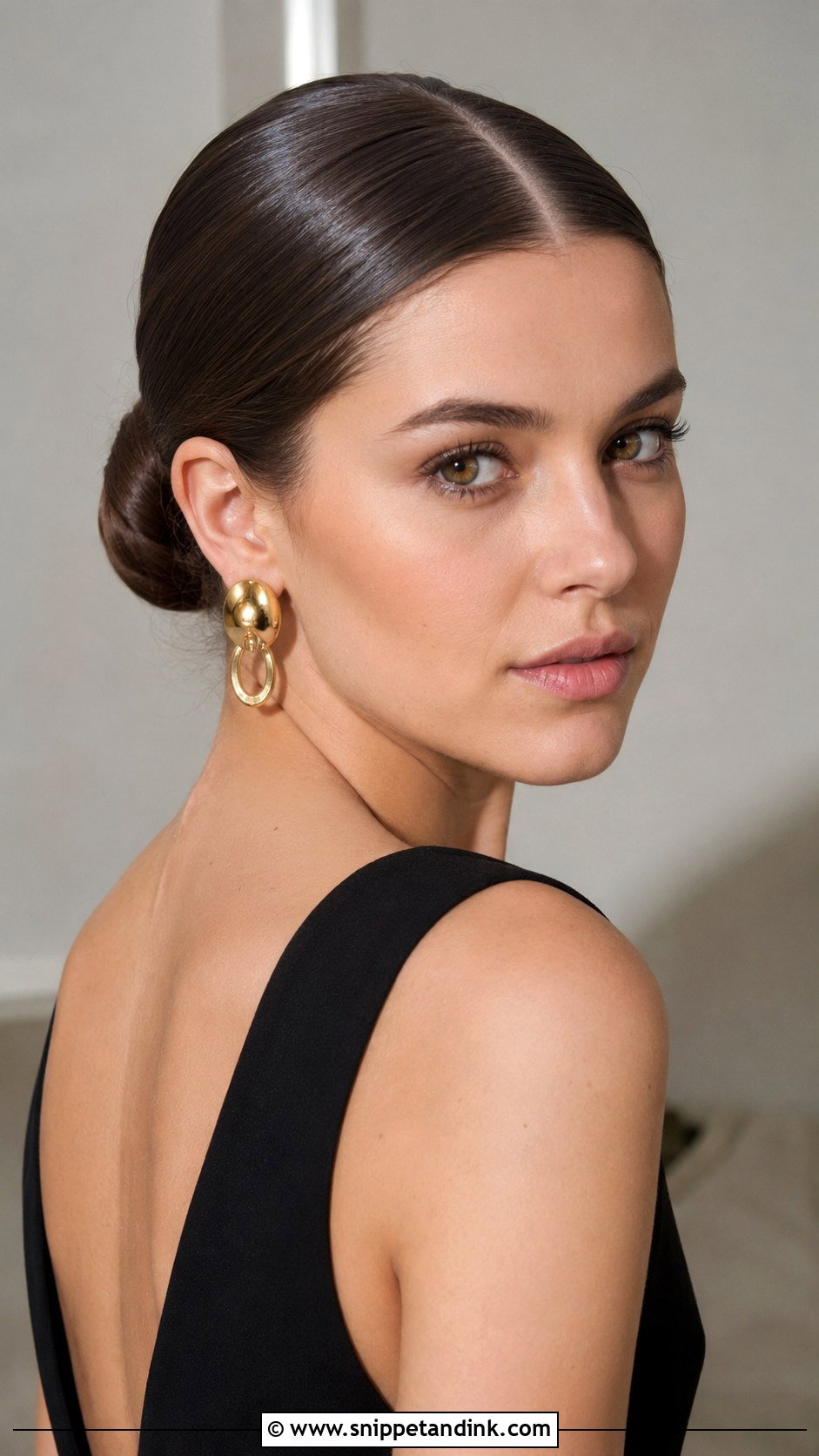 Sleek Bun With Center Part - Snippet and Ink - 25 Wedding Guest Hair Ideas