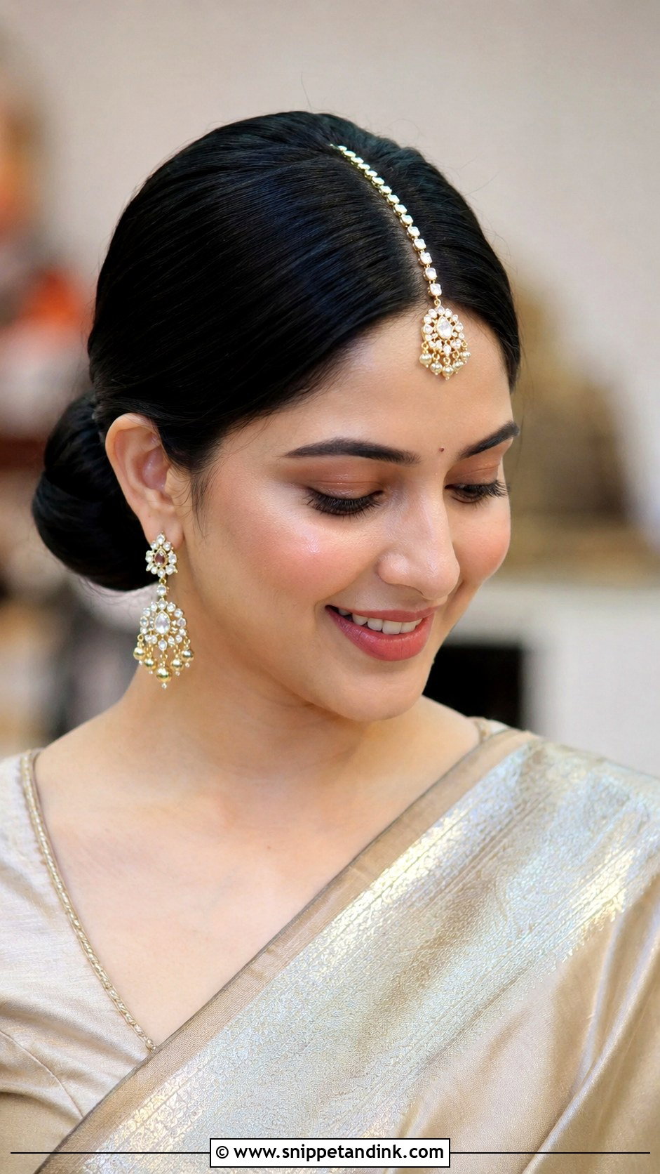Sleek Bun With Center Part - Snippet and Ink - 30 Indian Bridal Hairstyles