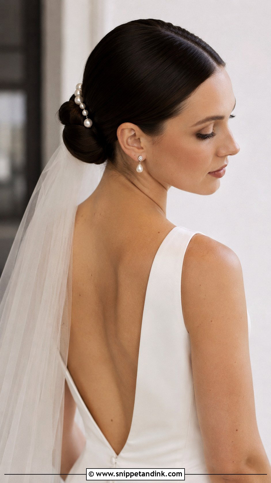 Sleek Bun With Center Part - Snippet and Ink - 20 Elopement Hairstyles
