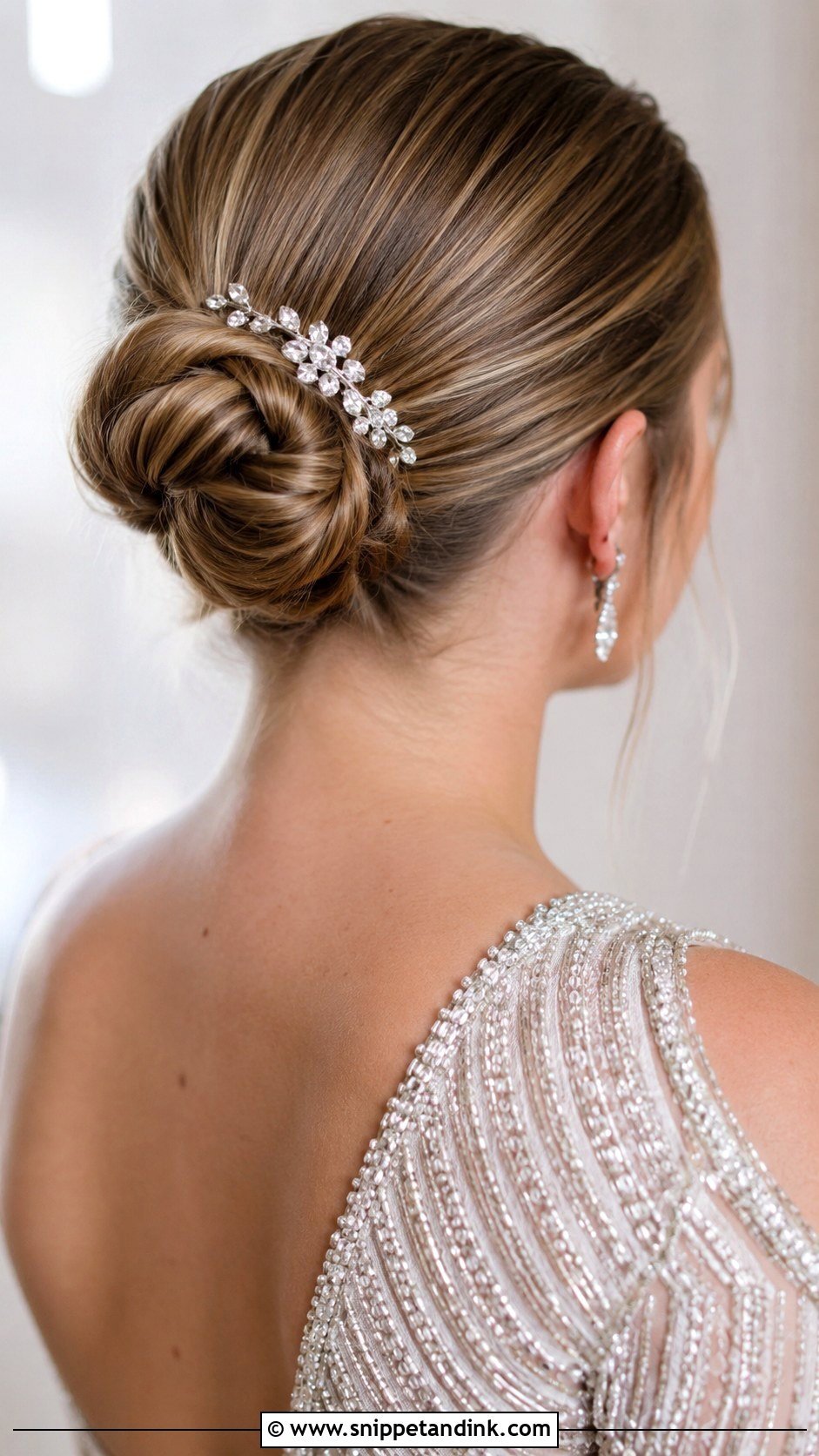 Sleek Bun With Crystal Comb - Snippet and Ink - 25 Sleek Bun Wedding Hair Ideas