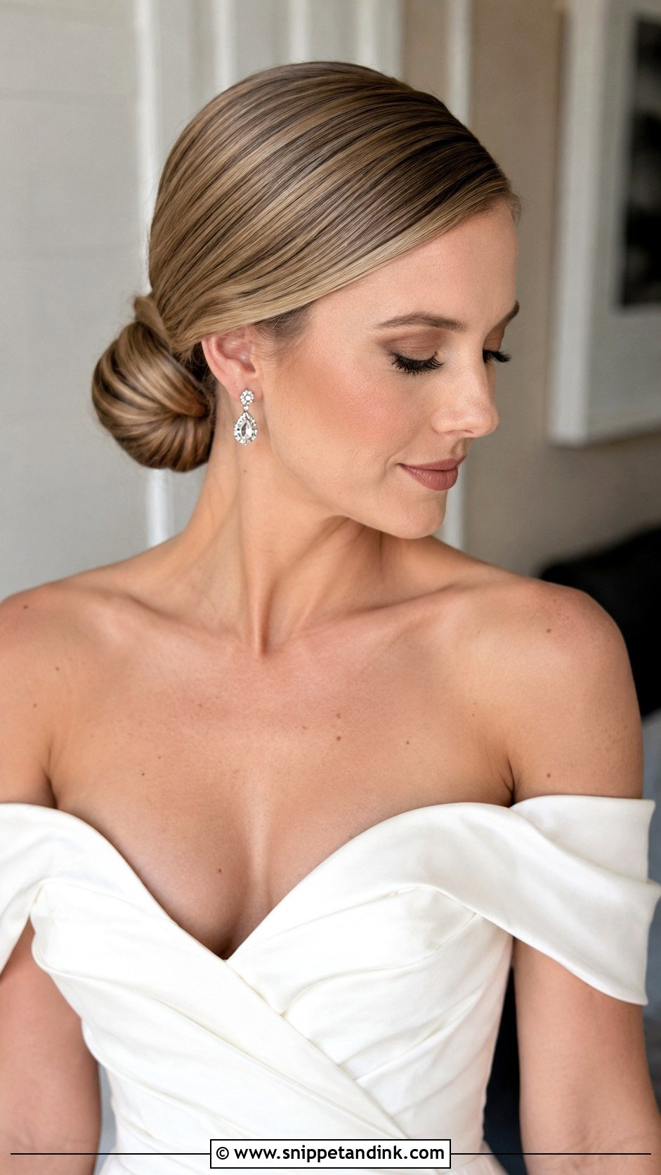 Sleek Bun With Deep Side Part - Snippet and Ink - 25 Sleek Bun Wedding Hair Ideas