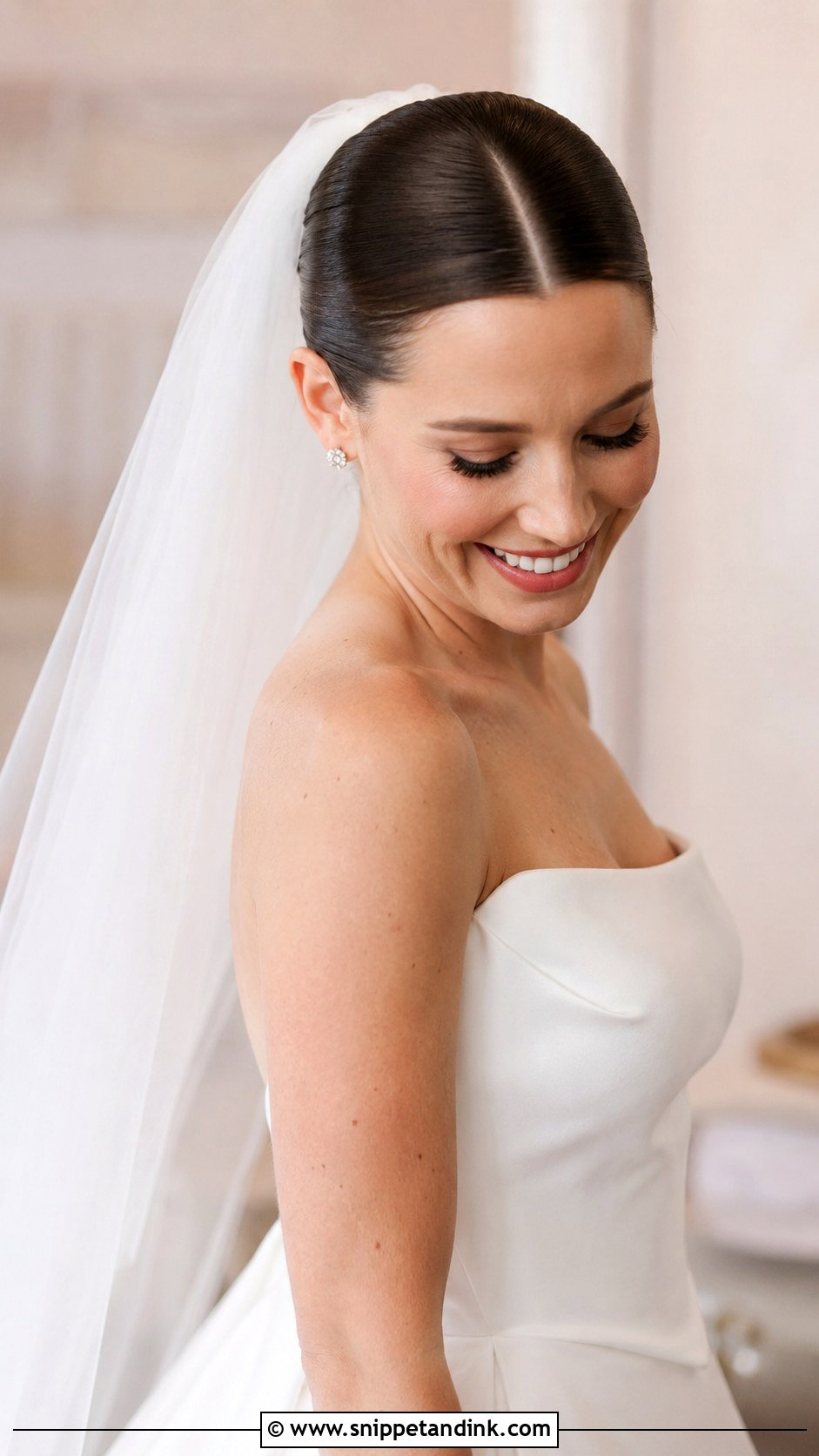 Sleek Bun With Long Veil and Center Part - Snippet and Ink - 20 Sofia Richie Wedding Hair Ideas